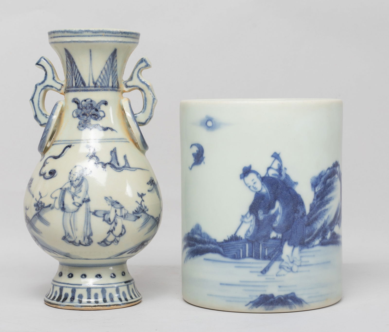 Chinese Blue & White Porcelain Vase & Brush Pot: The brush pot painted with a figure holding a hoe on shoulder, with bat and distant moon, the vase exterior painted with figural scene, flanked by a pair of faux-ring handles at the neck. Approx. 6.5*