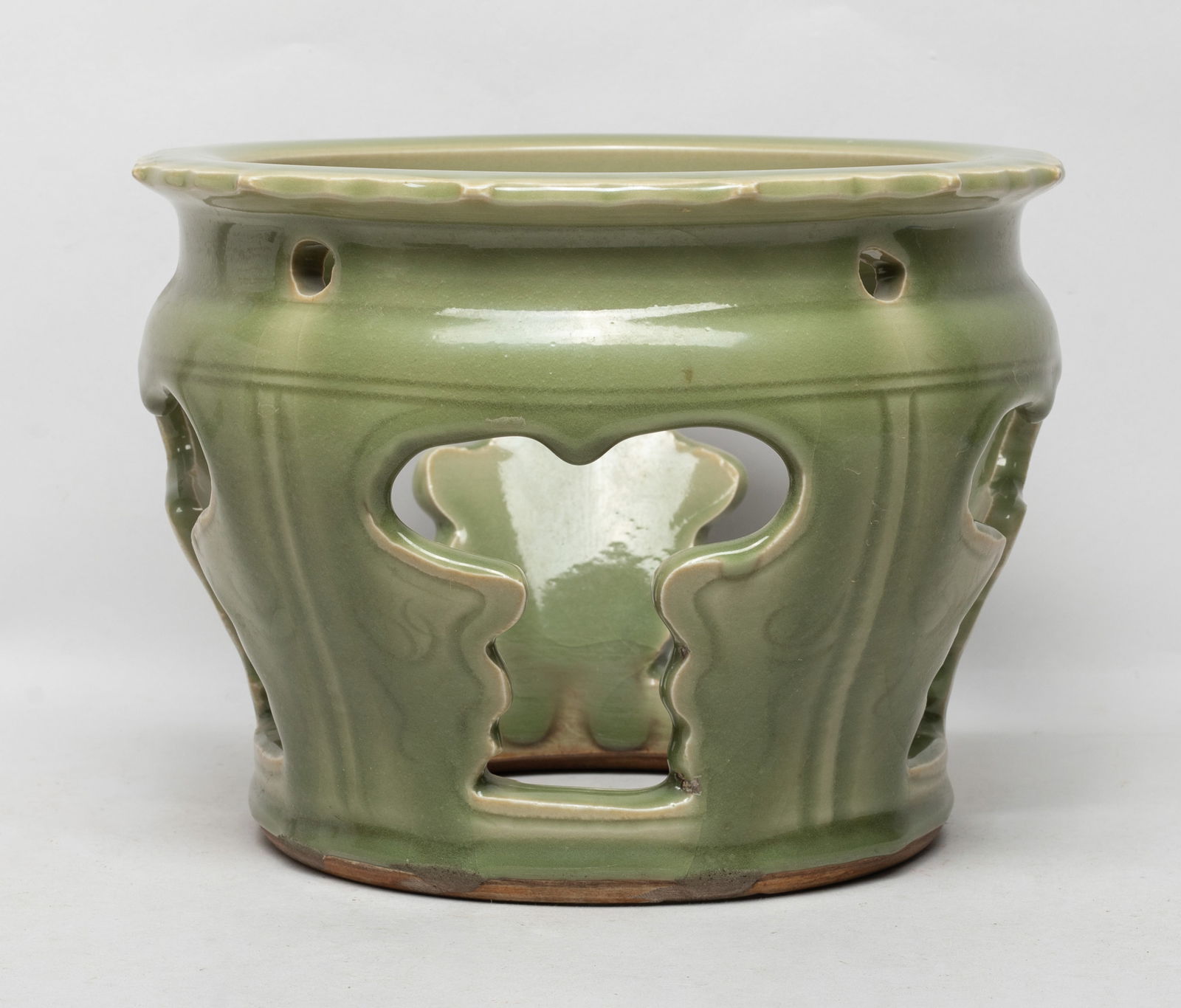 Massive Chinese Export Longquan Porcelain Base: Massive Chinese openwork Longquan porcelain base, overall covered with olive-green glaze. Approx. 6.6*9 inch.