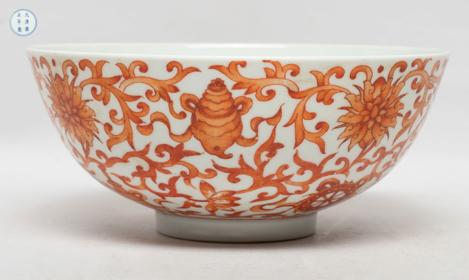 Estate Chinese Export Porcelain Bowl: The bowl exterior painted in copper red with eight Buddhist treasures among dense lotus foliage, the bottom marked with six characters enclosed in double circles. Approx. 5.9*2.5 inch.