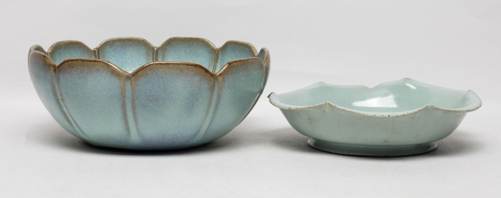 Two Repaired Chinese Export Porcelains: Including a deep bowl and a plate, each of floral form and covered with crackled celadon glaze, the bowl is repaired and the plate with chips. Approx. 8.3*3.2 inch.