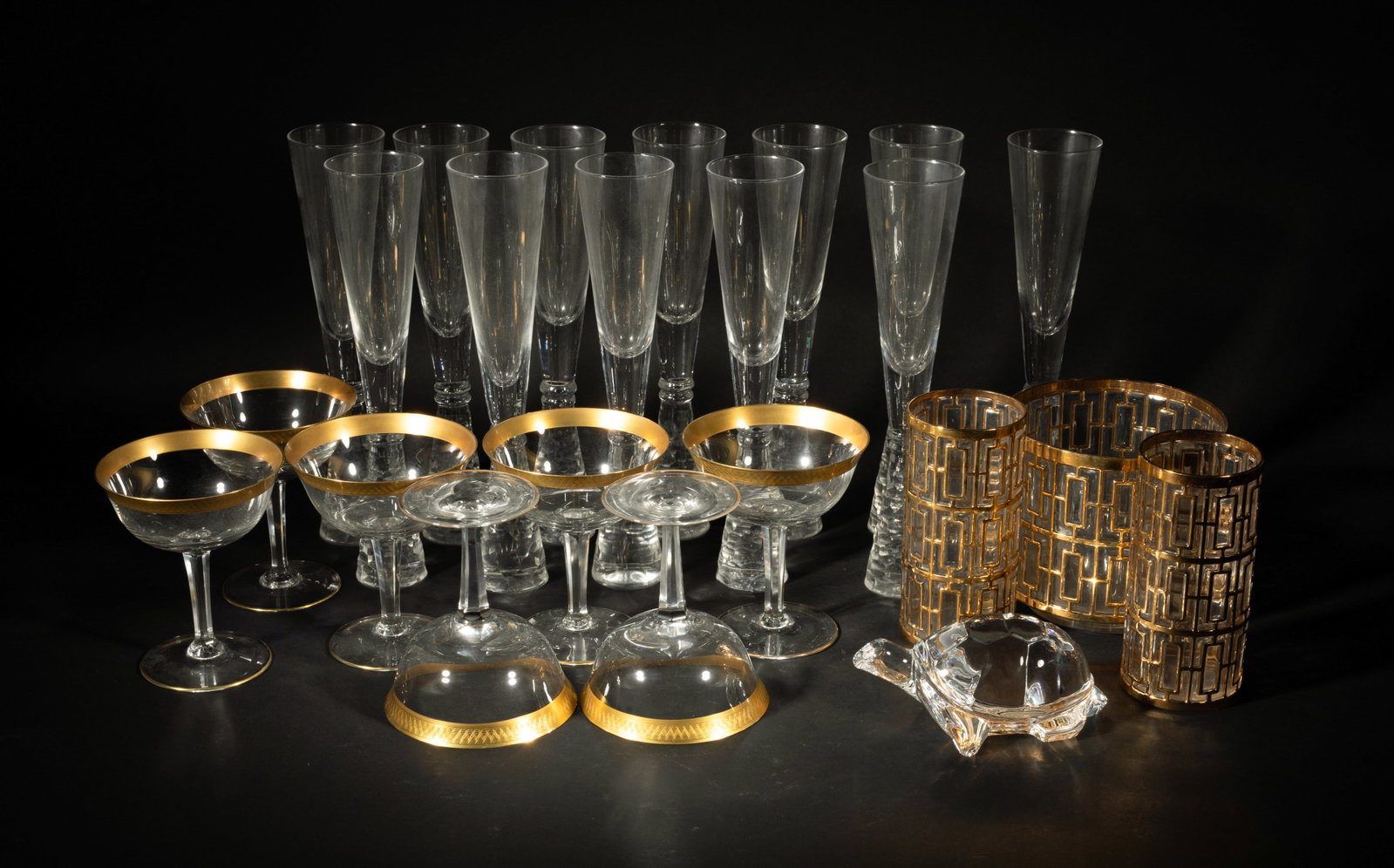 Vintage Large Set Gilt & Crystal Glass Wares: Large set of gilt crystal glass wine glass, vases and a turtle sculpture. Size varies.