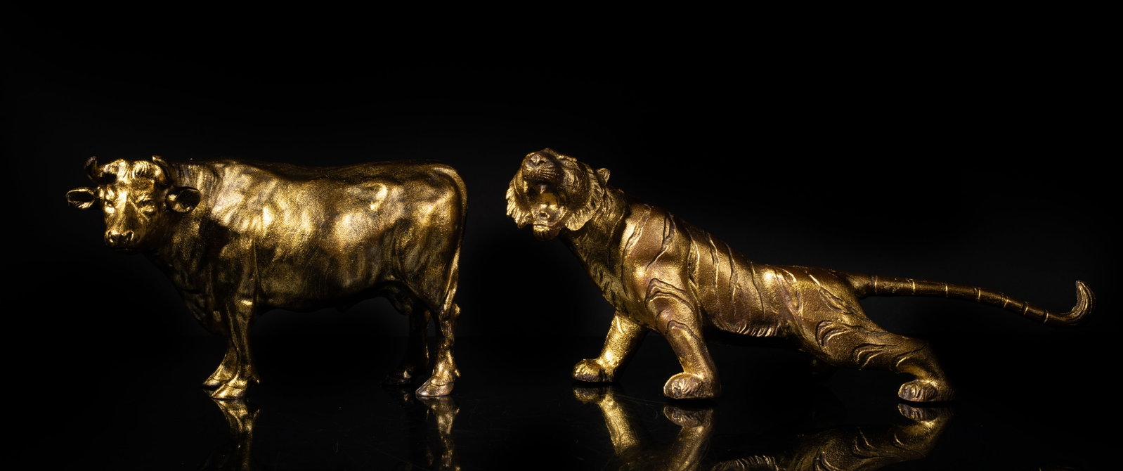 Late Meiji Type Japanese Sculptures: Japanese late Meiji type golden-colored metal lion and buffalo sculptures. Approx. 13.2*5.5*3.2 inch (lion size).