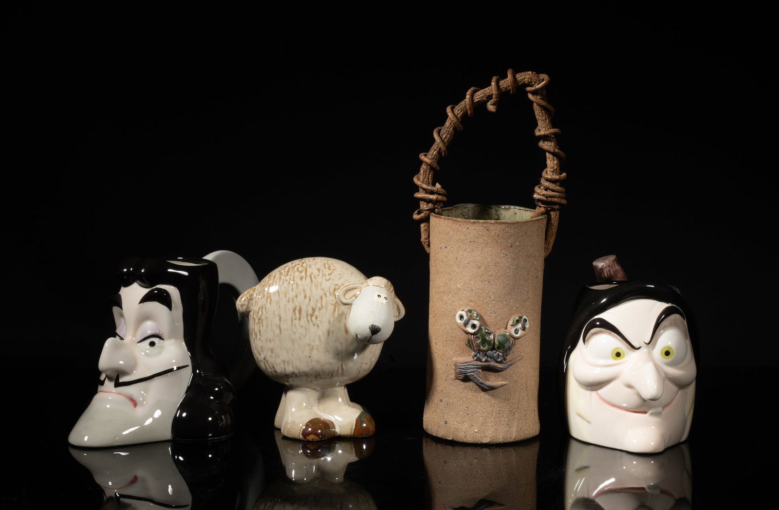 Mid-20th Studio Art Stone Wares: including a sheep sculpture, a pot, and two Disney mugs. Size varies.
