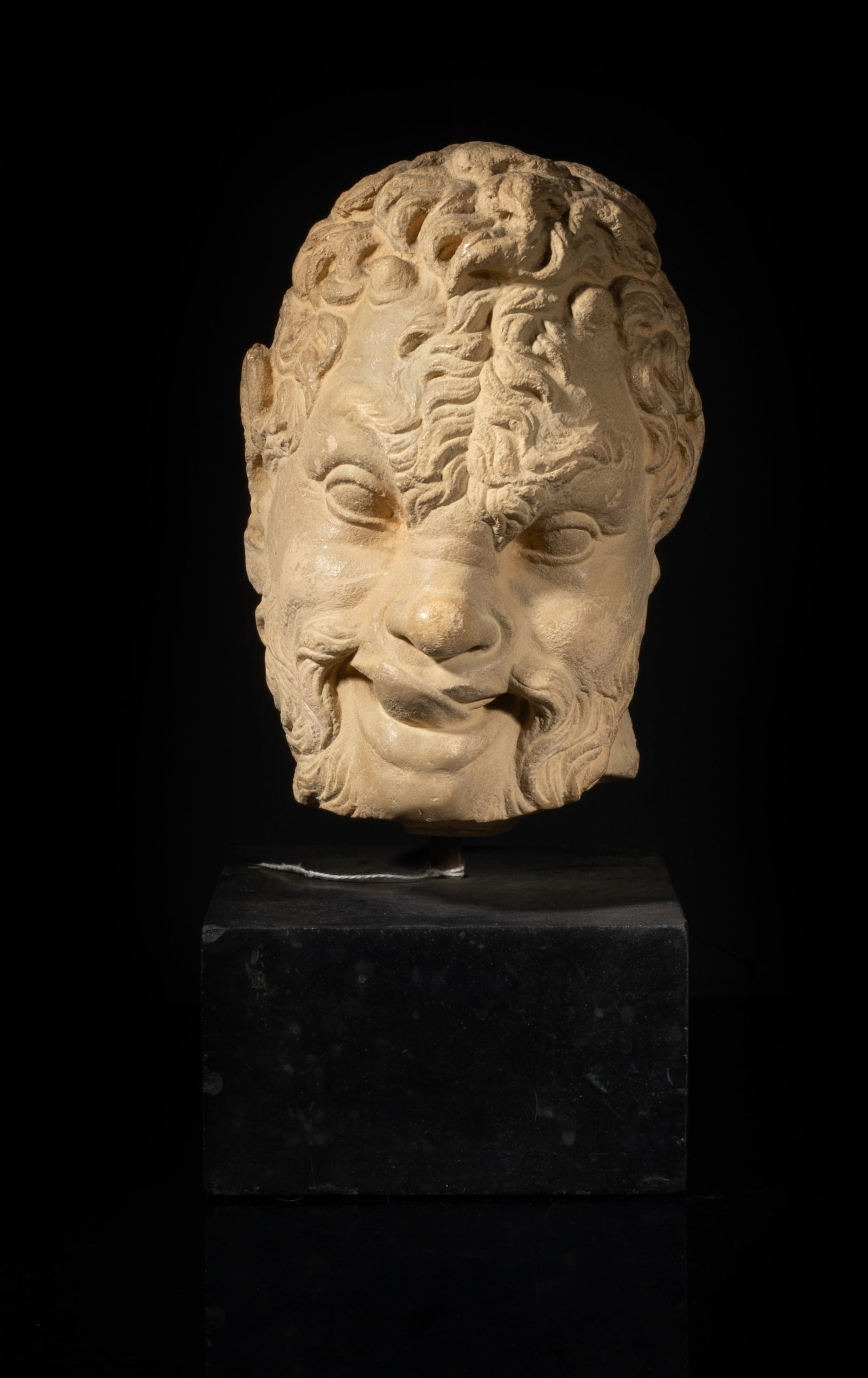 Austin Satyr Bacchus Pan Stone Bust Head: Carved into the head of an adult man, the curly short hair extends all the way to the forehead, the mouth is open, and the tongue licks the upper lip, with a square base. Approx. 10.5*5.6*4.8 inch