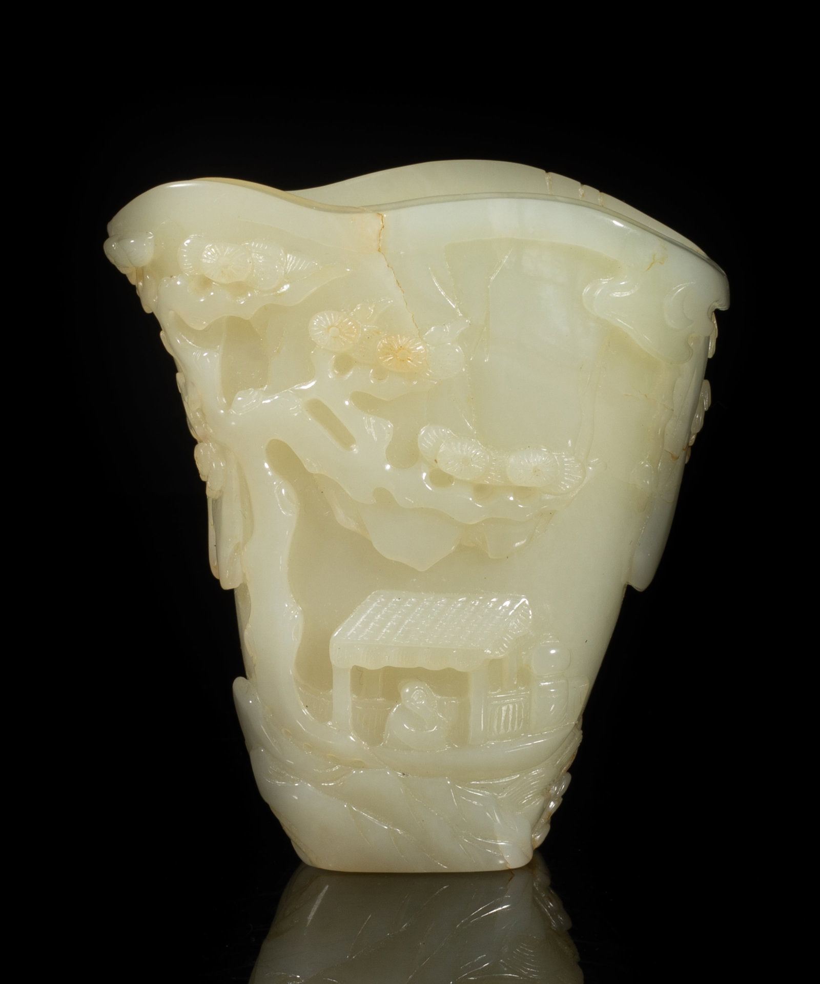 Chinese Russet Jade Carved Libation Vase: Finely worked in varying levels of relief with a continuous landscape, two sages on a boat, with lush growth of pine trees amongst rockworks and distant mountains. Approx. 3.3*3*1.8 inch. The Estate