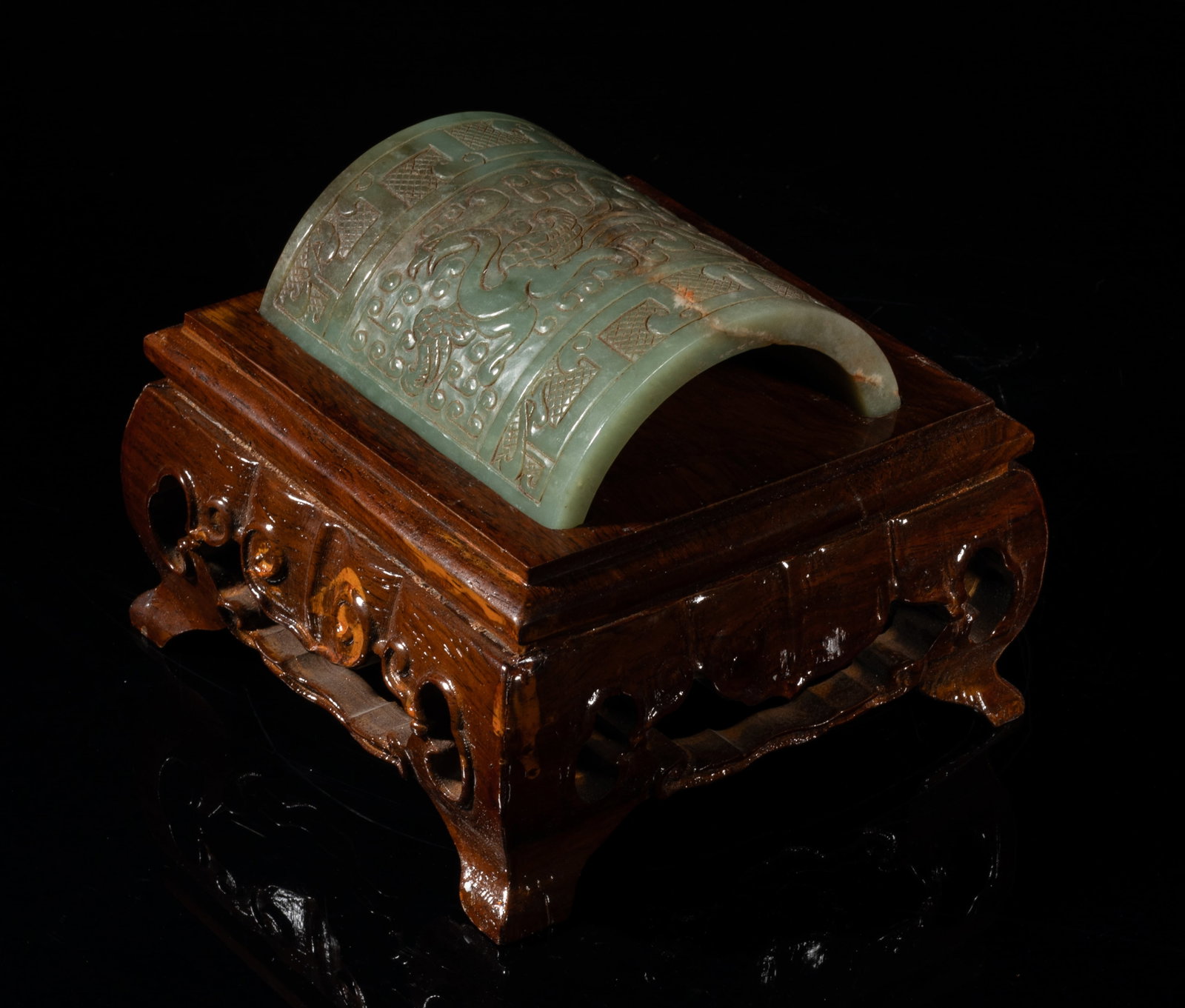 Special Chinese Jade Carved Tail on Base: Of semicircular shape, carved with an archaistic beast among scrolls, between bands of elongated stylized beasts, with a tall square base. Approx. 5.6*5.6*4.5 inch (w/ stand). The Estate of the Joe &