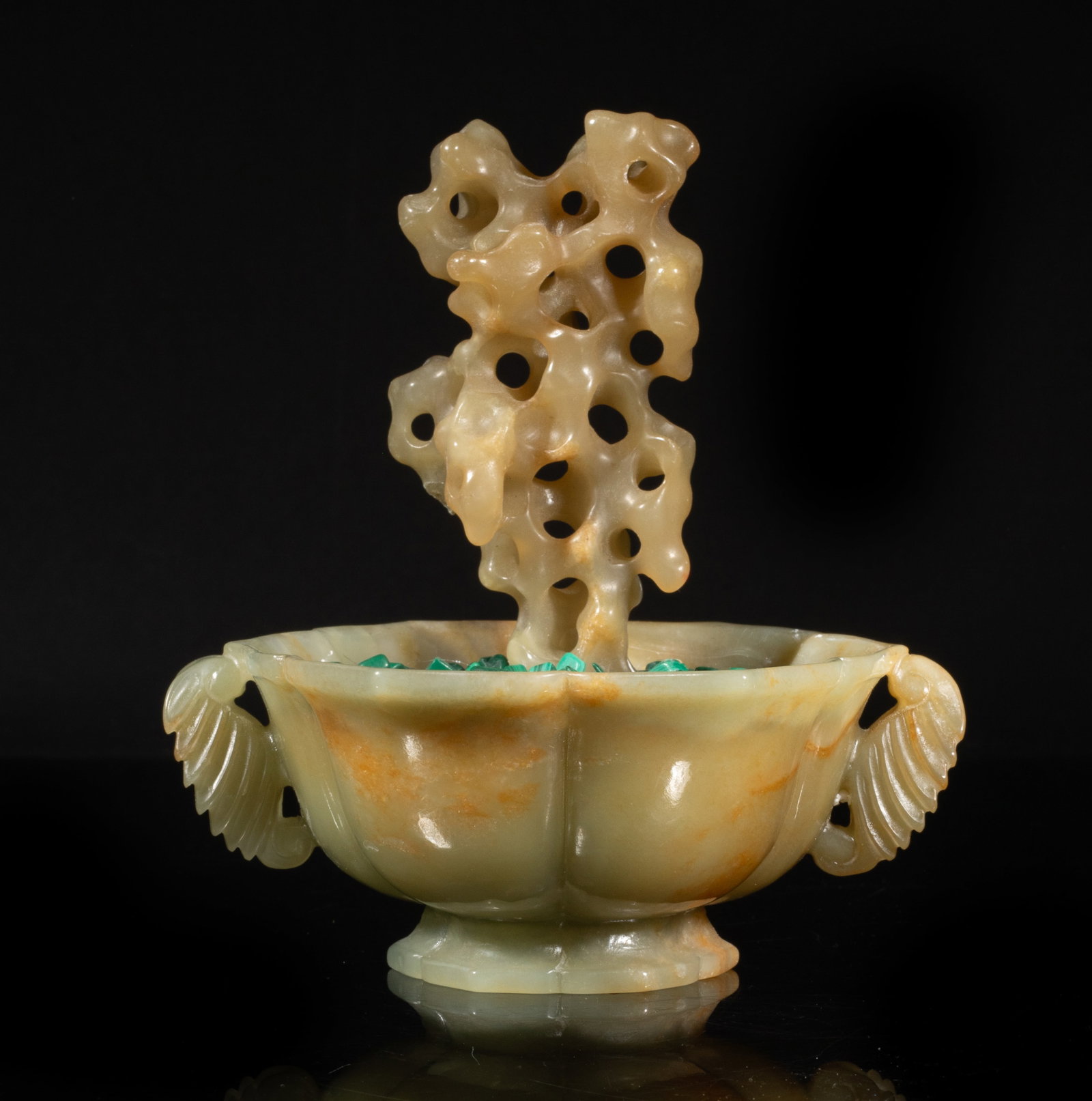 Chinese Russet Jade, Malachite Bonsai Sculpture: Chinese russet jade carved scholar stone sculpture, and malachite pieces, on a floral shaped jade pot, flanked by a pair of leaf shaped handles. Approx. 5.1*4.8*4 inch. The Estate of the Los Angeles.