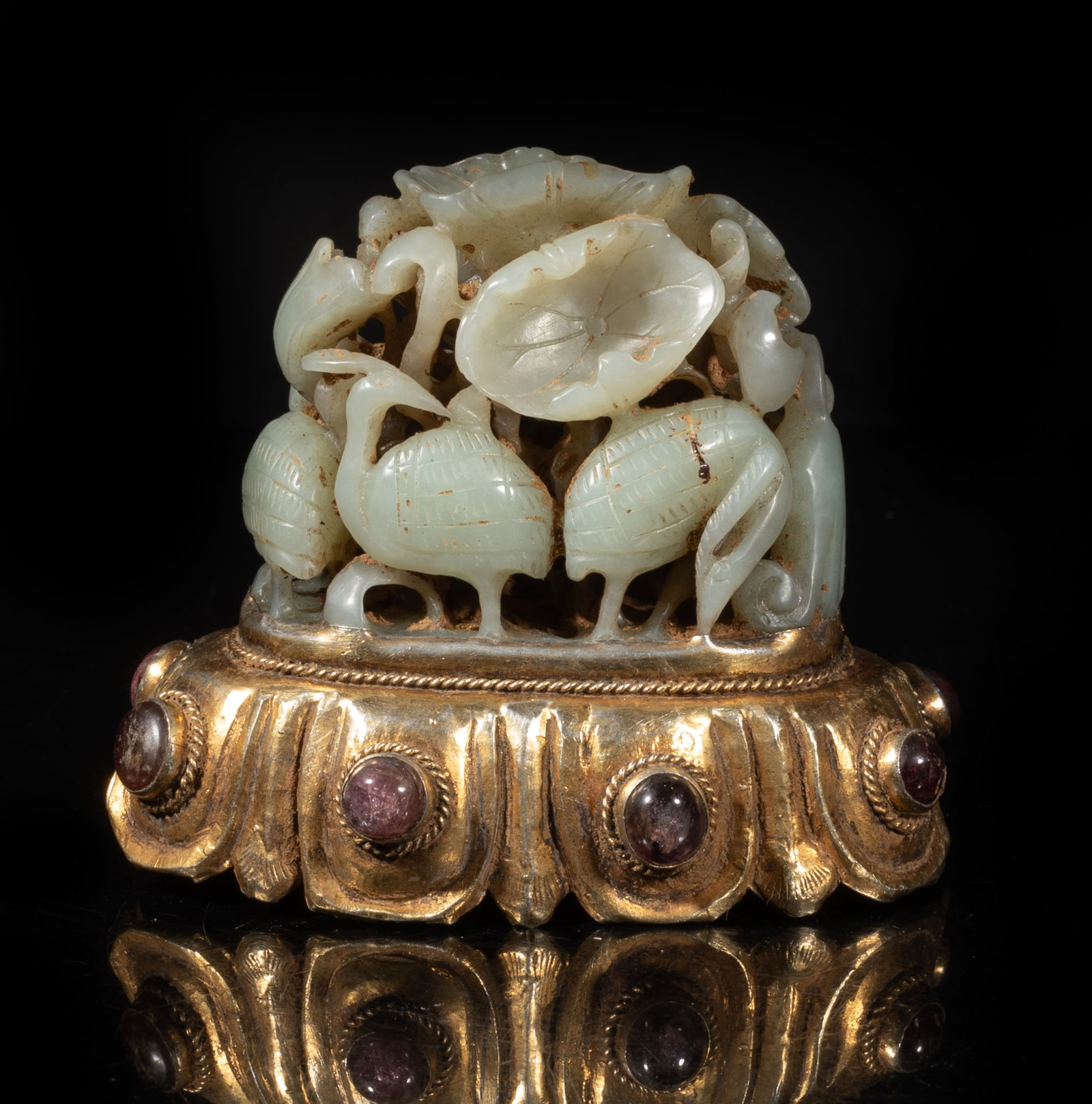 Chinese Jade, Gemstone, Gold on Silver Sculpture: Deftly carved and pierced in openwork as five elegant egrets among towering lotus stalks and leaves, swaying and bending in the breeze, the gold-on-silver base inlaid with gemstone. Approx. 3.5*3*2.6