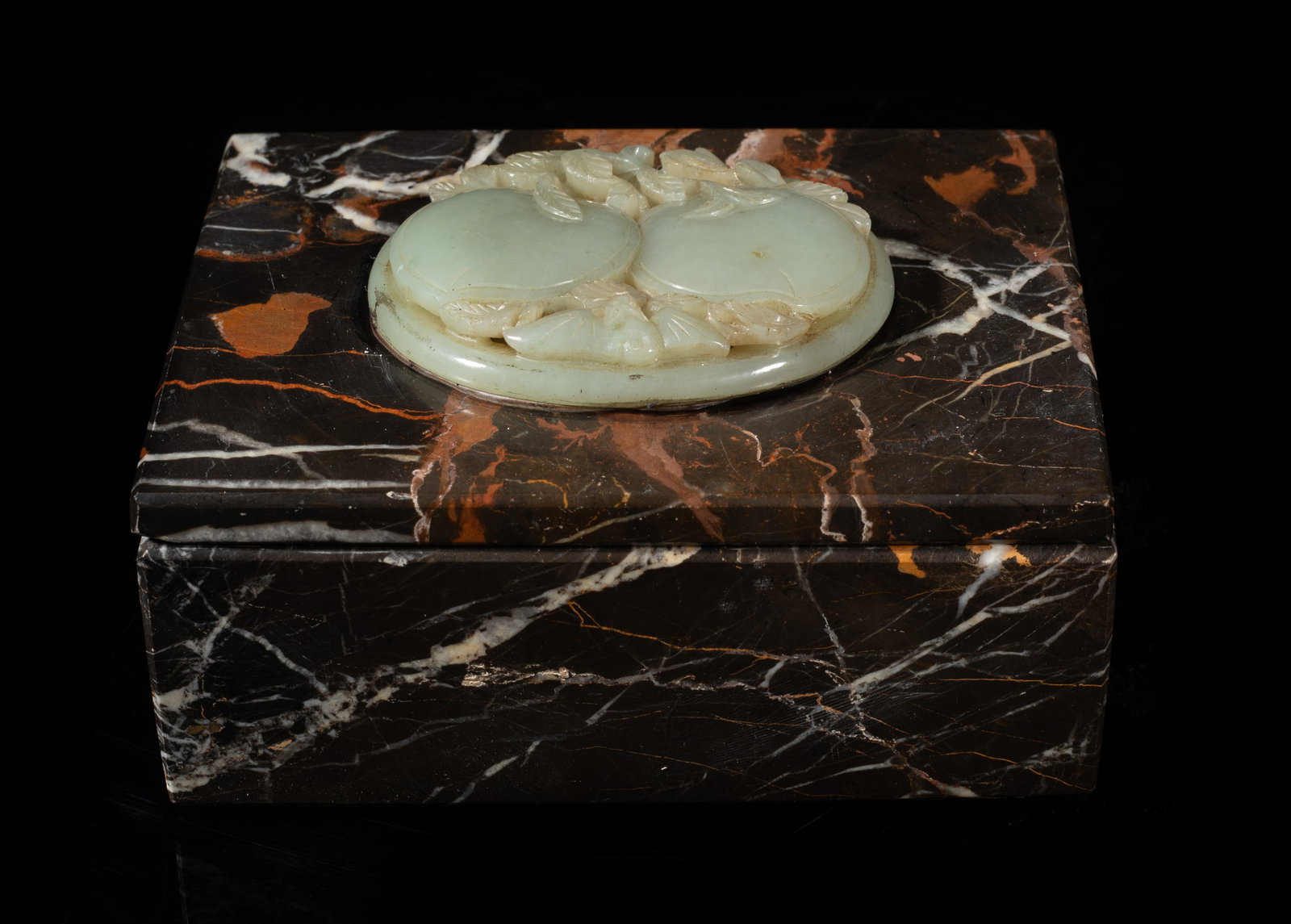 Chinese Jade Covered Marble Box: Collectible Chinese marble box of rectangular shape, inlaid with a pale celadon jade plaque on the top, carved in openwork with two peaches issuing from leafy stems, with a bat below.