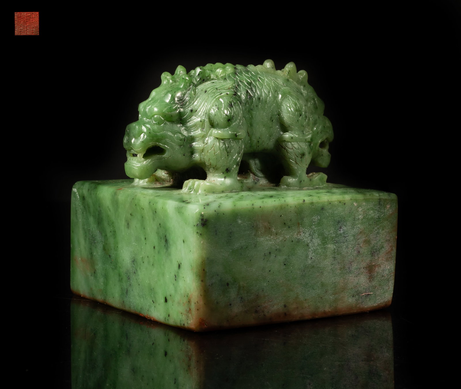 Large Chinese Spinach Jade Seal: Carved from a mottled green stone with dark brown and white inclusions, the finial carved as a double dragon on the squared base. Approx. 3.52*3.45*3.5 inch.