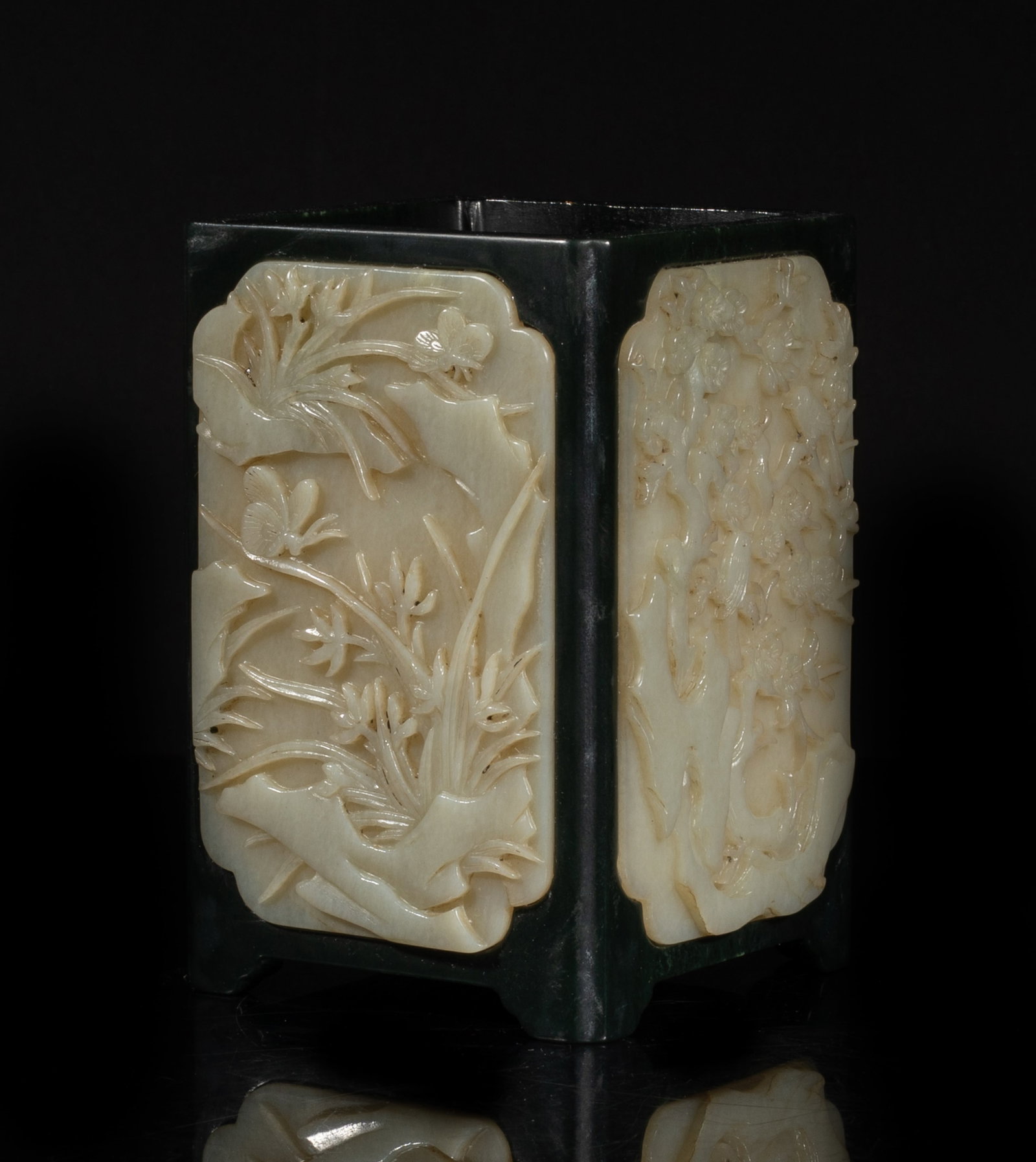 Heavy Chinese Jade Carved Brush Pot: Of square section, each side inset with a jade plaque, carved in raised relief with chrysanthemum and dragonfly, orchid and butterfly, plum blossoms and magpie, or bamboo and bat. Approx. 5.1*3.6*3.6