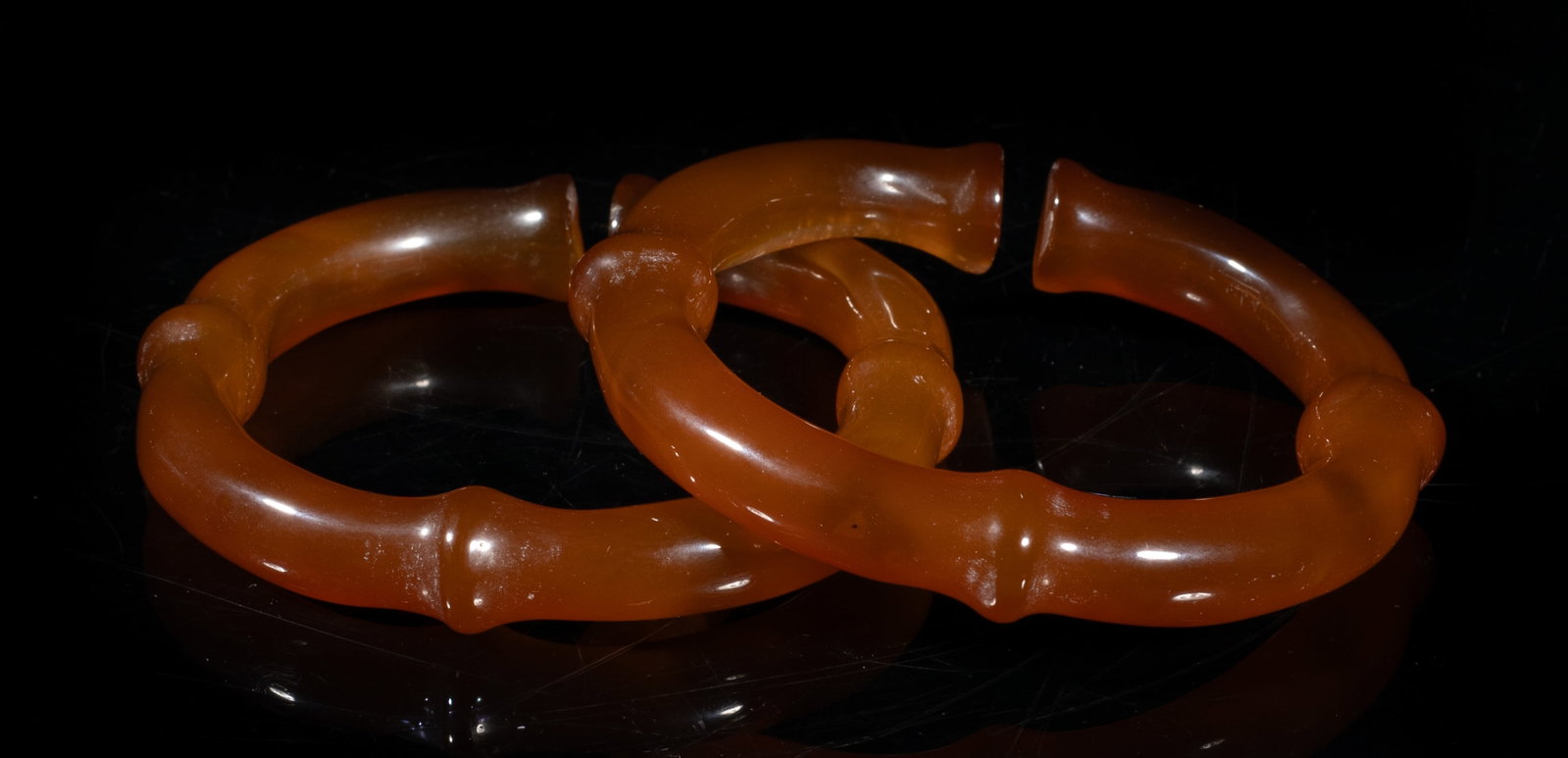 Two Rare Chinese Cameo Agate Bangles: Two collectible Chinese cameo agate open bangles carved of bamboo form. Approx. 3.24 inch outer diameter, 2.14 inch inner diameter (larger bangle). The Estate of the Consignment Store Closed Sale, Pal