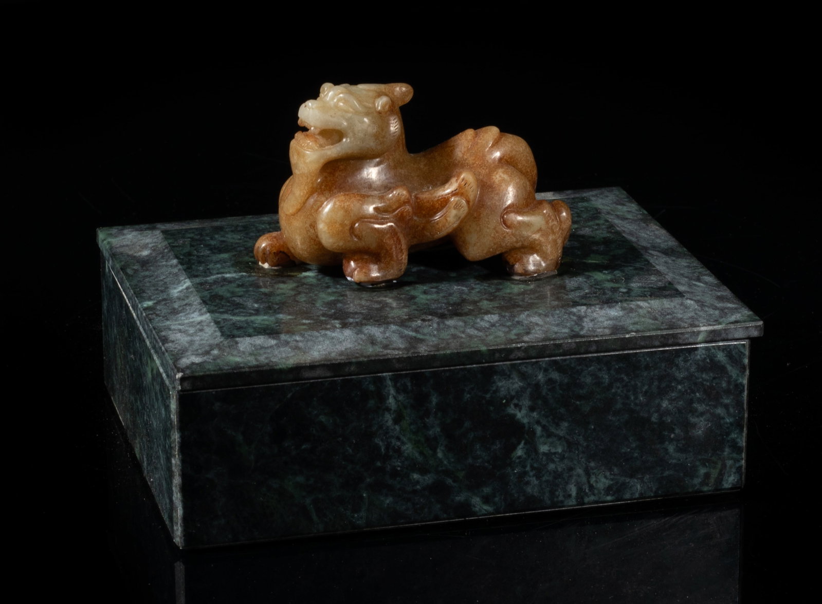 Chinese Russet Jade Handle Marble Box: Collectible Chinese marble box of rectangular shape, surmounted with a russet jade carved beast on the top, detailed with a single horn, bulging eyes, and agape mouth baring its teeth. Approx.