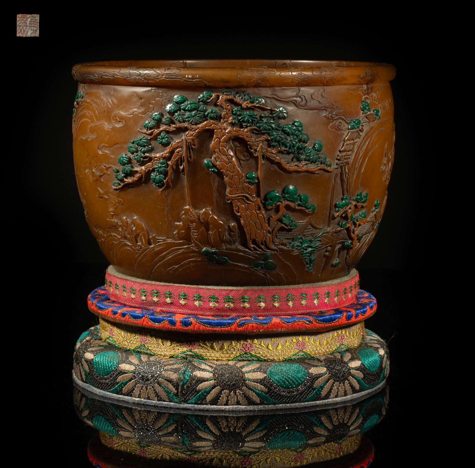 Chinese Translucent Shoushan Stone Water Pot: The water pot exterior carved with a continuous scene depicting scholars in various activities in landscape, the interior with scrolling clouds, the bottom incised with a four-character mark, with