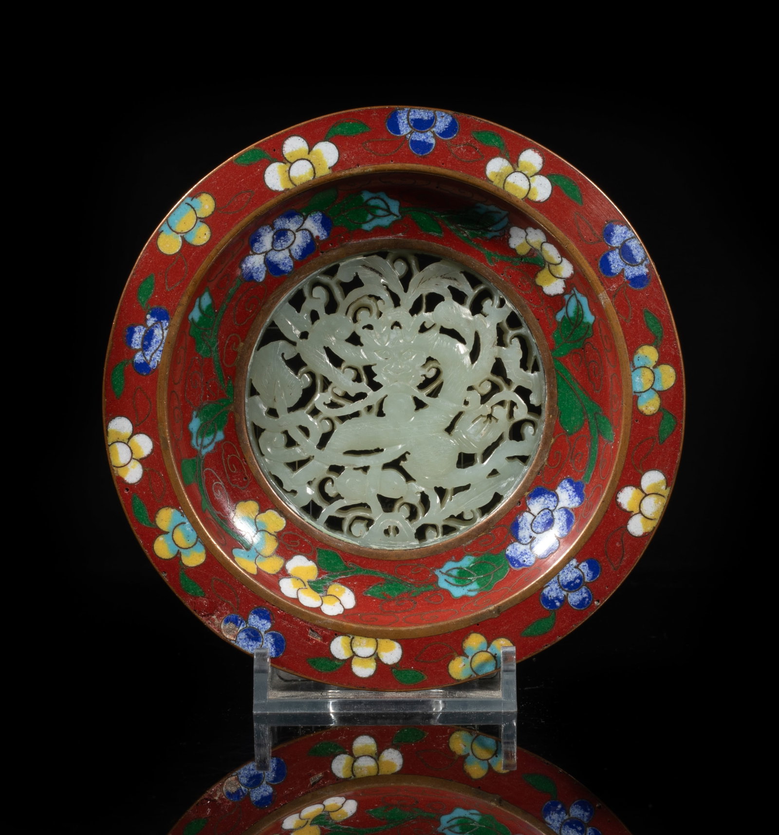 Chinese Cloisonne Inlaid Jade Plate: The plate centre inset with a jade plaque carved in openwork with a dragon sinuous amidst foliage scrolls, the sides enameled with flowers on dark red ground, the exterior glazed in turquoise blue col