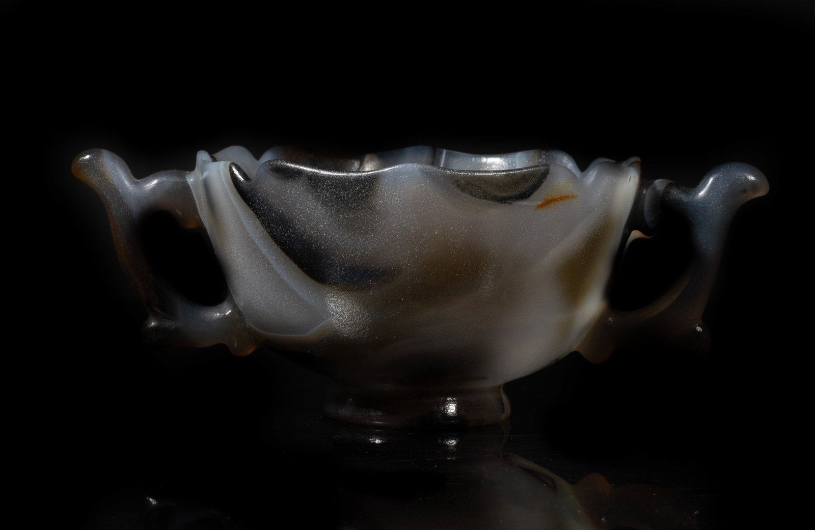 Rare Chinese Late Ming Type Shadow Agate Cup: Collectible Chinese shadow agate cup of floral form with two handles, the surface finely smoothed. Approx. 5.6*3.5*2 inch.