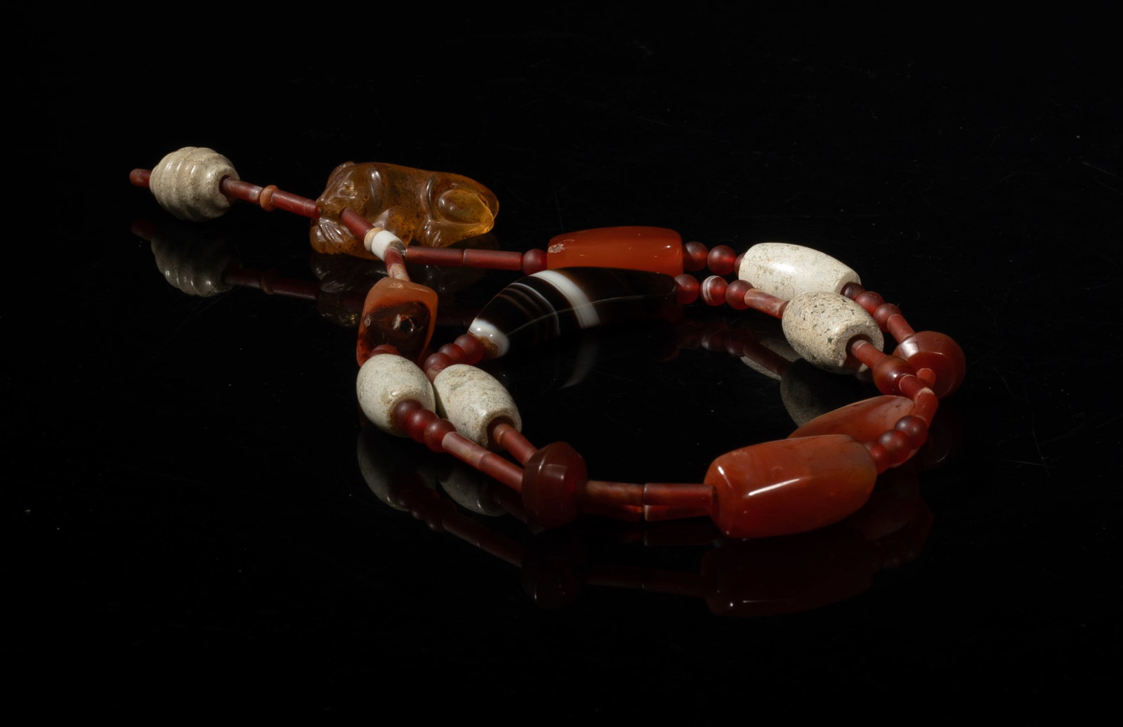 Early Chinese Agate, Stone, Jasper Necklace: Long Chinese agate, jasper and stone carved necklace. Approx. 26 inch L.