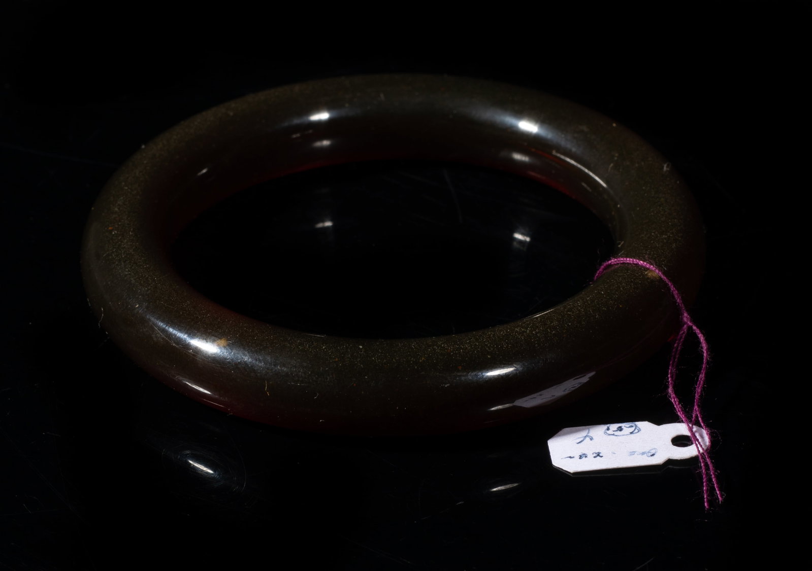 Vintage Chinese Cherry Amber Bangle: Vintage Chinese cherry amber carved bangle. Approx. 29 gram, 3.35 inch outer diameter, 2.4 inch inner diameter.