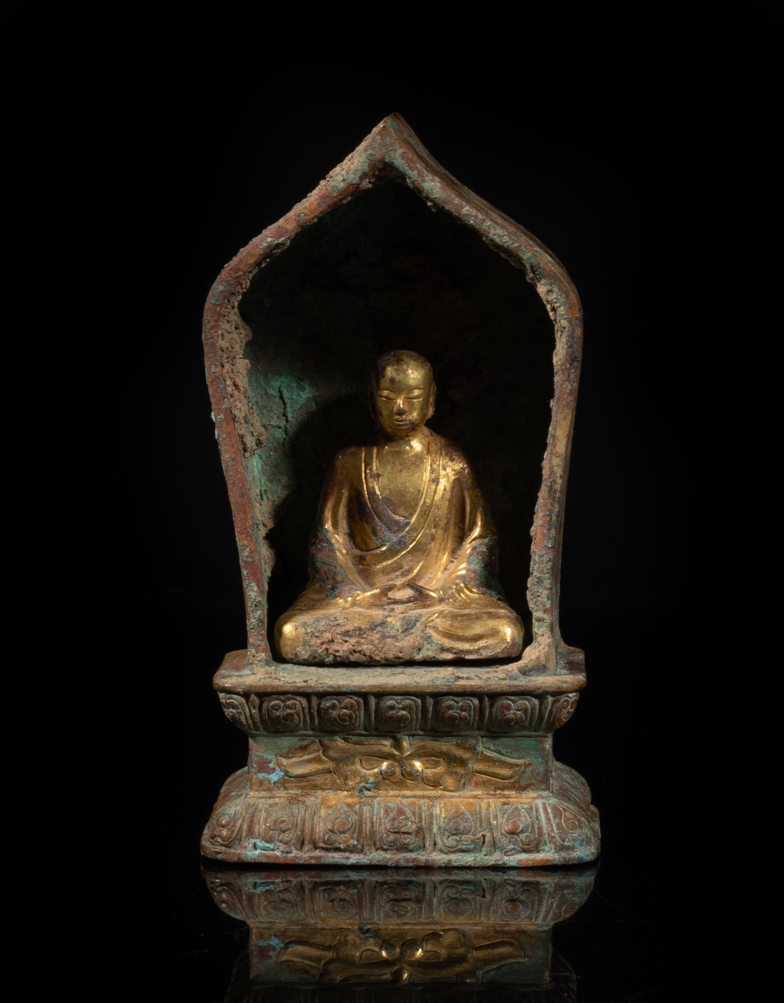 Rare Chinese Early Type Gold on Bronze Buddha: The Buddha cast in seated pose, the hands in dhyana mudra, the case cast of lotus petal shape, the base carved with bands of lotus petals. Approx. 4.7*2.5*1.8 inch.