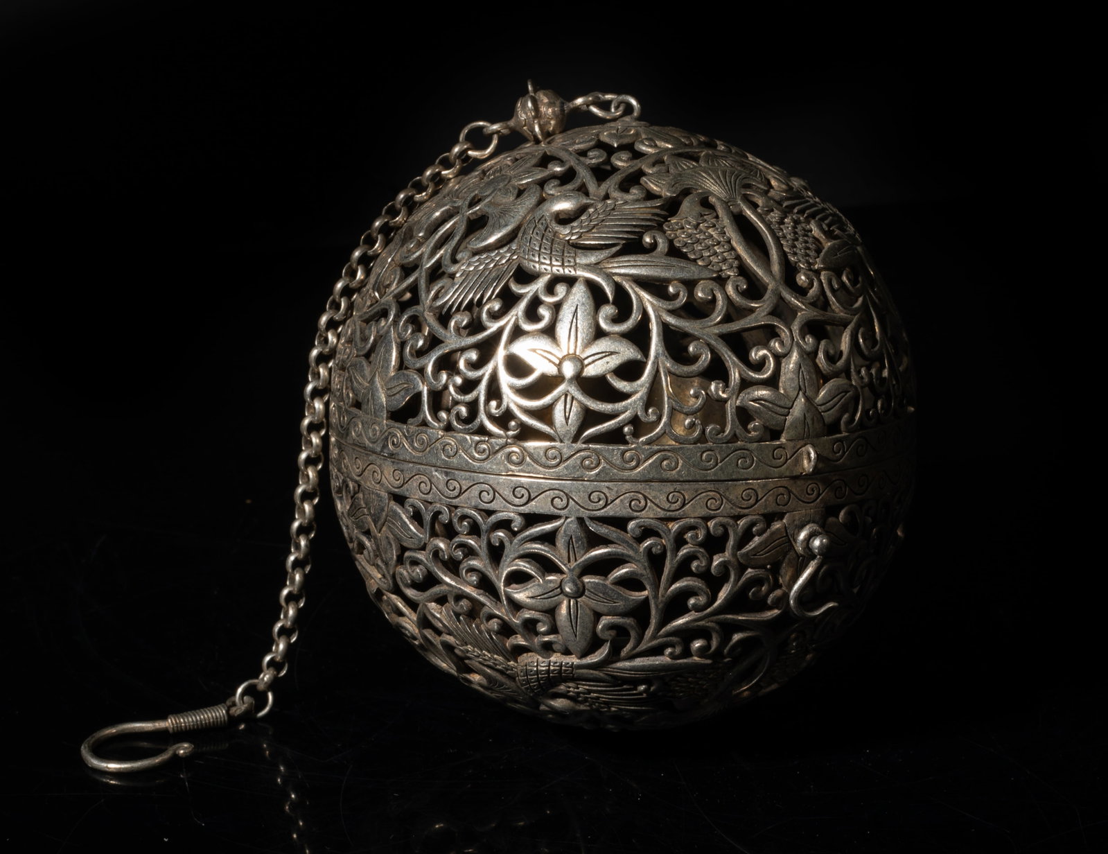 Large Unusual Chinese Hanging Incense Burner: The globular Chinese hanging incense burner, carved in openwork with birds flying amidst flowers and grape vines. Approx. 3.9 inch D