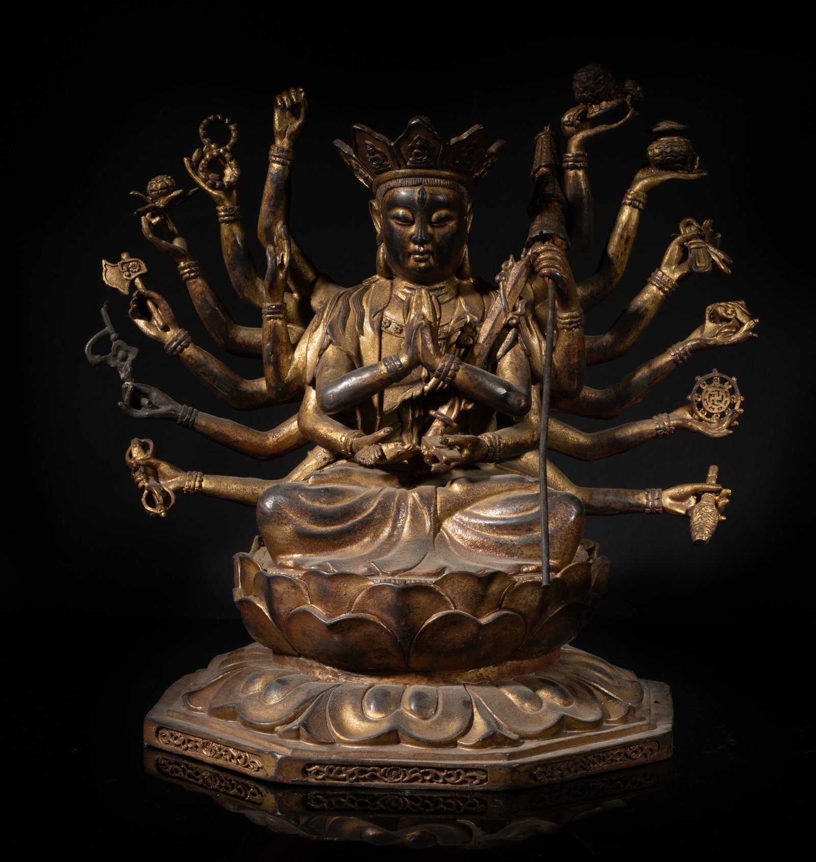 Large Chinese Gold on Bronze Sculpture of Buddha: The Buddha cast seated on a double-layered lotus throne, the nine pairs of hands in elegant mudra or holding various implements. Approx. 11*11*8.2 inch. The Estate of the Store Closed Sale, Palm Sprin