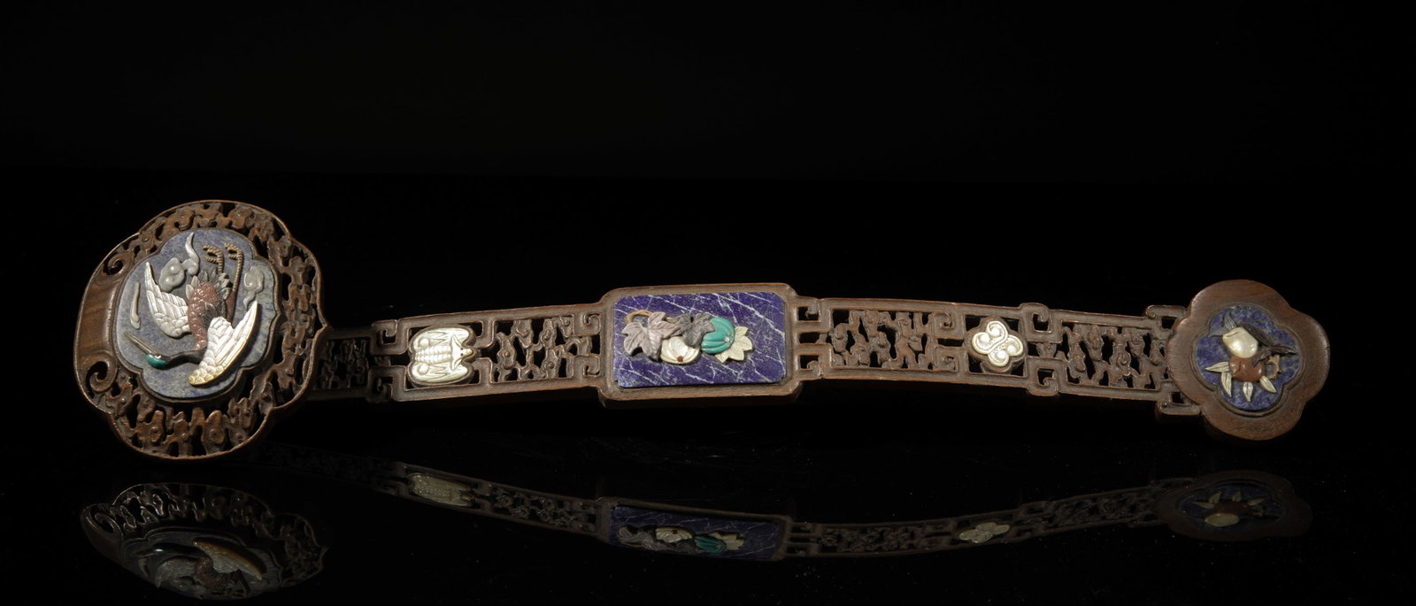 Rare Chinese Wood Ruyi Inlaid Lapis, MOP: Embellished on the head with gemstone and mother-of-pearl carved with a flying crane, the central panel with pumpkins and leaves, and the bottom panel with peaches, the shaft reticulated with clouds