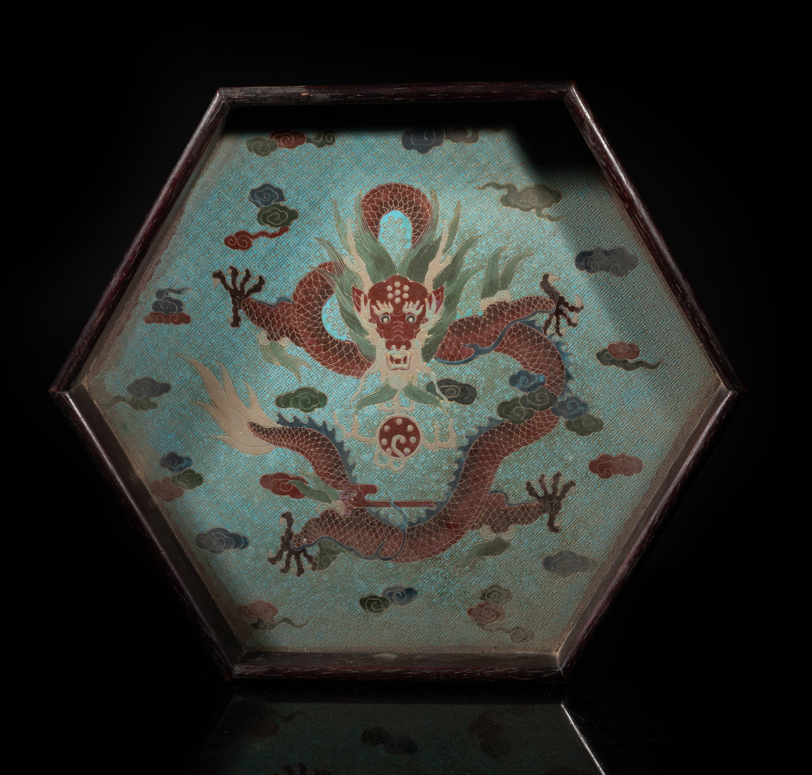 Chinese Wood, Lacquer Dragon Tray: Of hexagonal section, the interior incised and painted with a dragon chasing a flaming pearl amidst clouds on turquoise glazed fret ground, the underside marked with five characters and a seal mark.