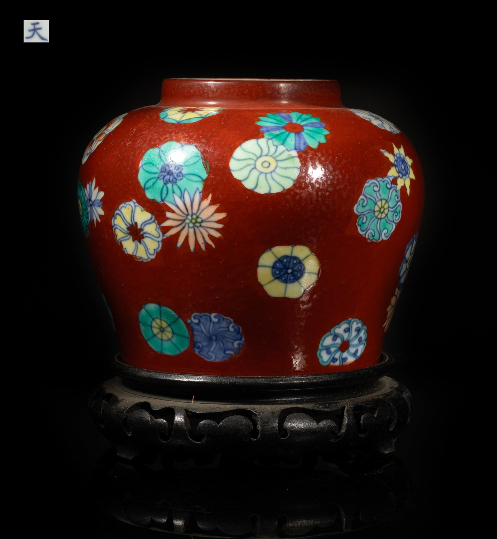 Estate Chinese Export Porcelain Jar: The jar exterior painted with blossoming flowers on red glazed body, the bottom with a Tian character mark, with stand. Approx. 5.5*4.6 inch (w/o stand).