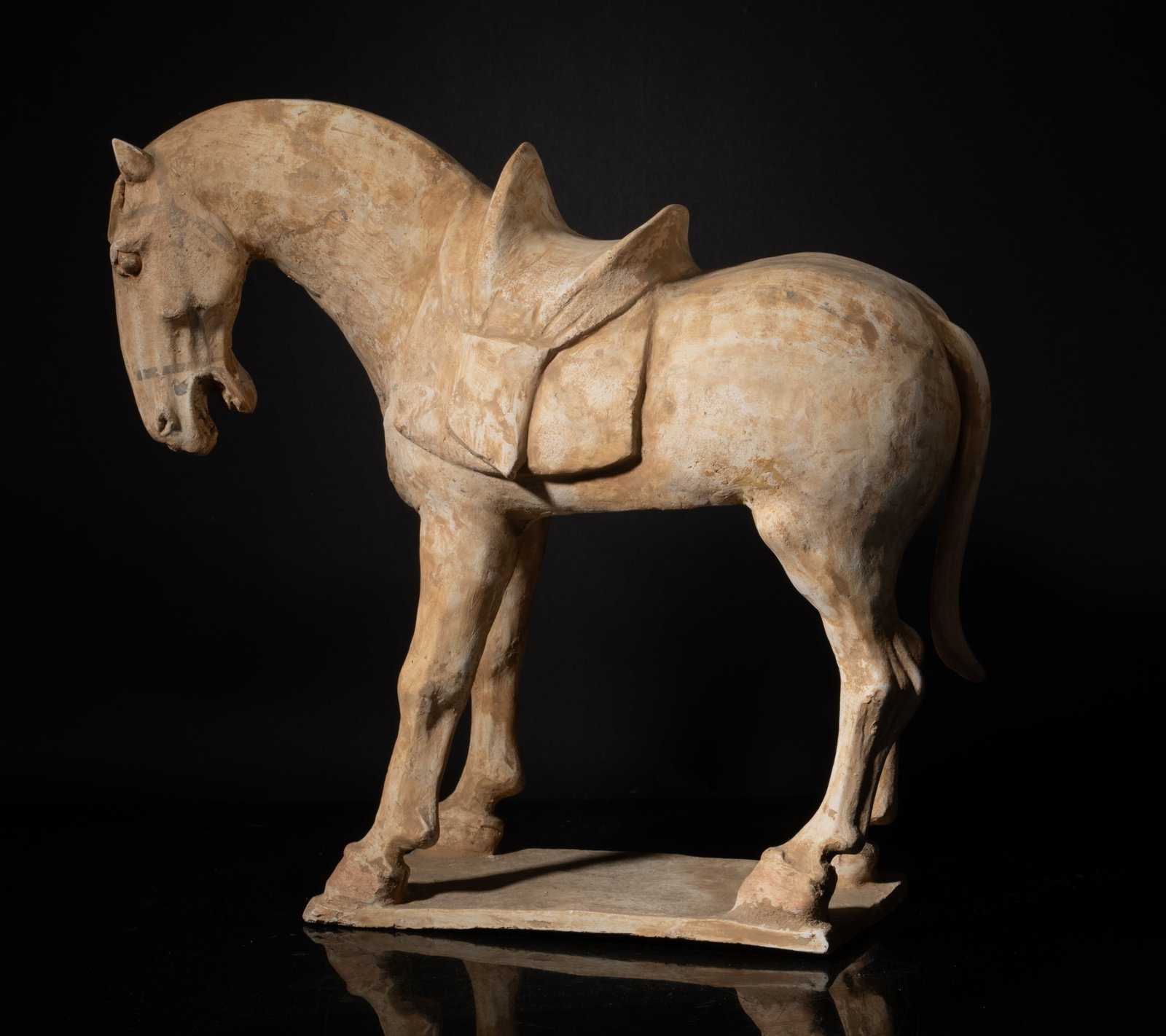 Antique Tang Chinese Pottery Horse: Collectible antique Tang Chinese pottery horse sculpture, standing foursquare on a rectangular base, the horse head turned slightly to the left. Approx. 12.5*13.5*5 inch.