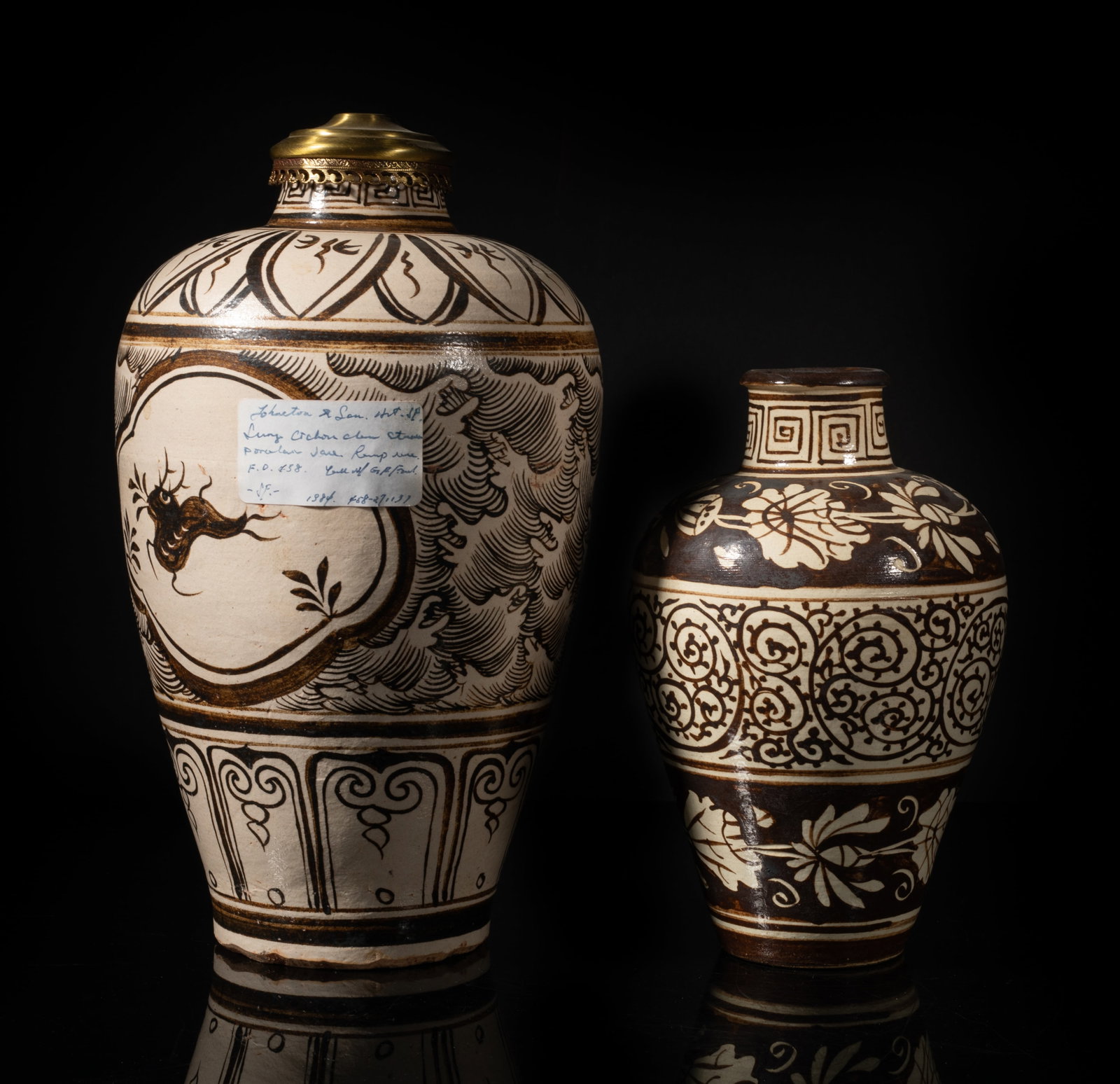 Two Chinese Cizhou Ware Porcelain Vases: One vase painted with two ruyi-head shaped medallions of deer, between bands of leaves and petals, the other vase painted with scrolls between bands of foliage. Approx. 10.6*6.2 inch (larger).