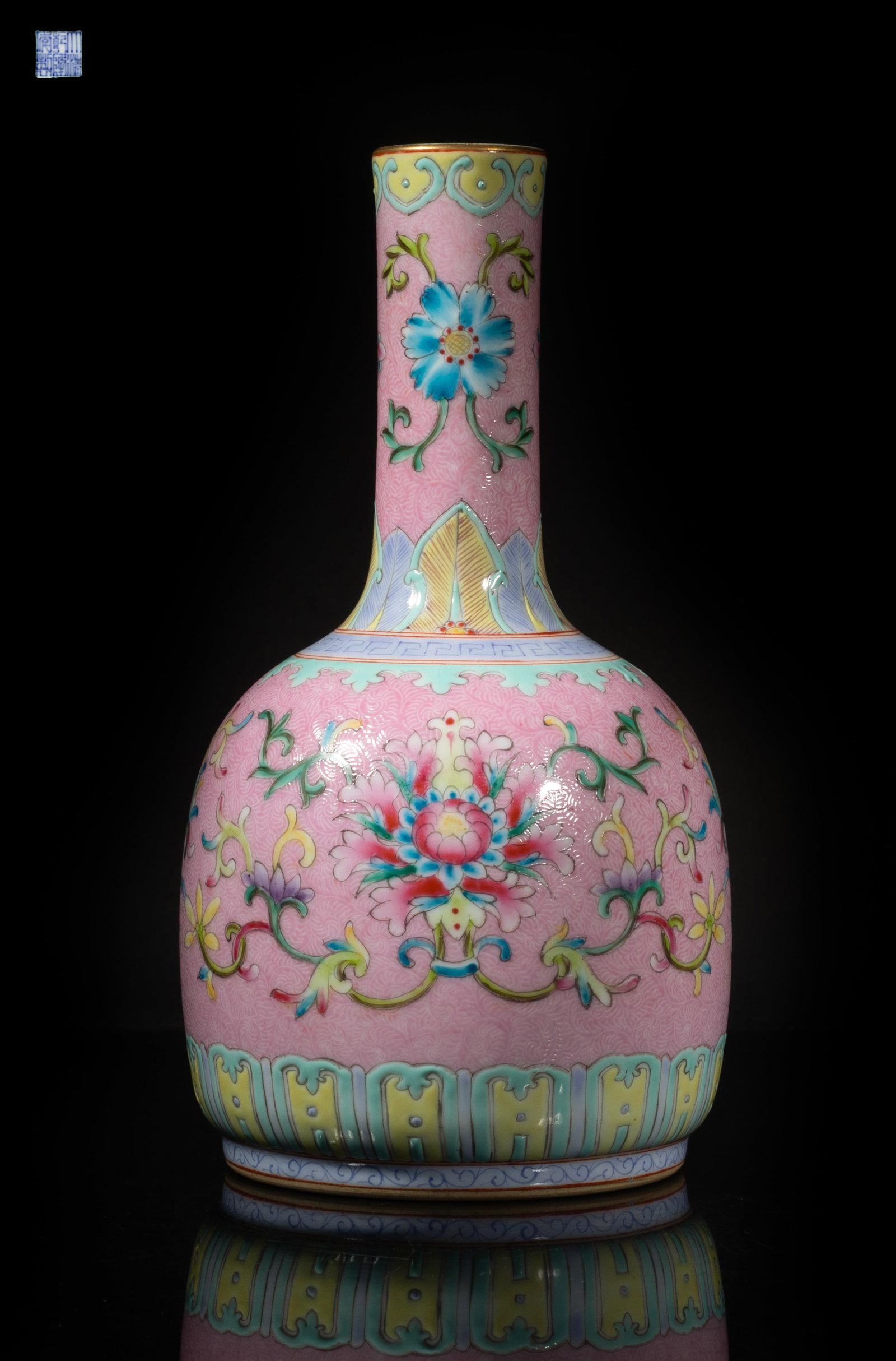Chinese Carved Famille Rose Porcelain Vase: The ovoid body rising to a cylindrical neck, the exterior enameled with lotus on pink glazed scroll ground, the bottom and interior neck turquoise glazed, the bottom with a six-character mark.