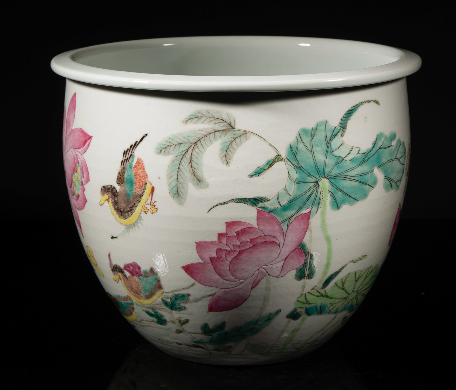 Estate Large Chinese Export Porcelain Garden Pot: The pot exterior enameled and painted with a vivid scene, depicting mandarin ducks, butterflies, and blossoming lotus. Approx. 9.3*7.3 inch. The Estate of the Estate & Moving Sale of Huntington