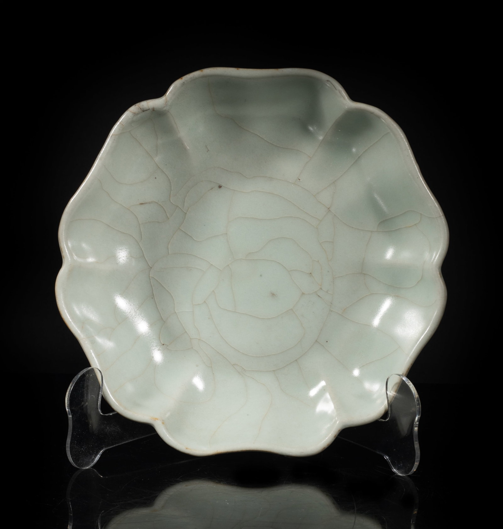 Chinese Kuan Ware Porcelain Lotus Plate: Molded of lotus form, overall covered with bluish celadon glaze suffused with a matrix of crackles. Approx. 8*2 inch.