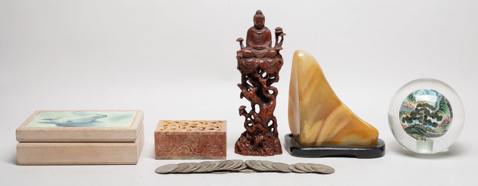 Chinese Wood Buddha, Stones, Glass Ball: Including a wood box, a stone box, a stone table sculpture, a glass ball painted inside with landscape scene, a wood Buddha sculpture, and Fengshui coins. Size varies.