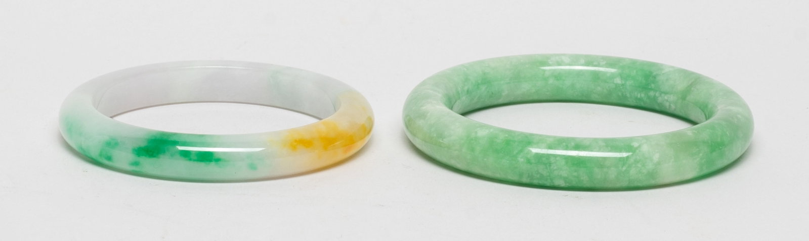 Two Chinese Export Bangles: Two Chinese export bangles. Approx. 3.22 inch outer diameter, 2.35 inch inner diameter (larger bangle). The Estate of the Store Closed Sale. Downtown. Los Angeles. 2021.