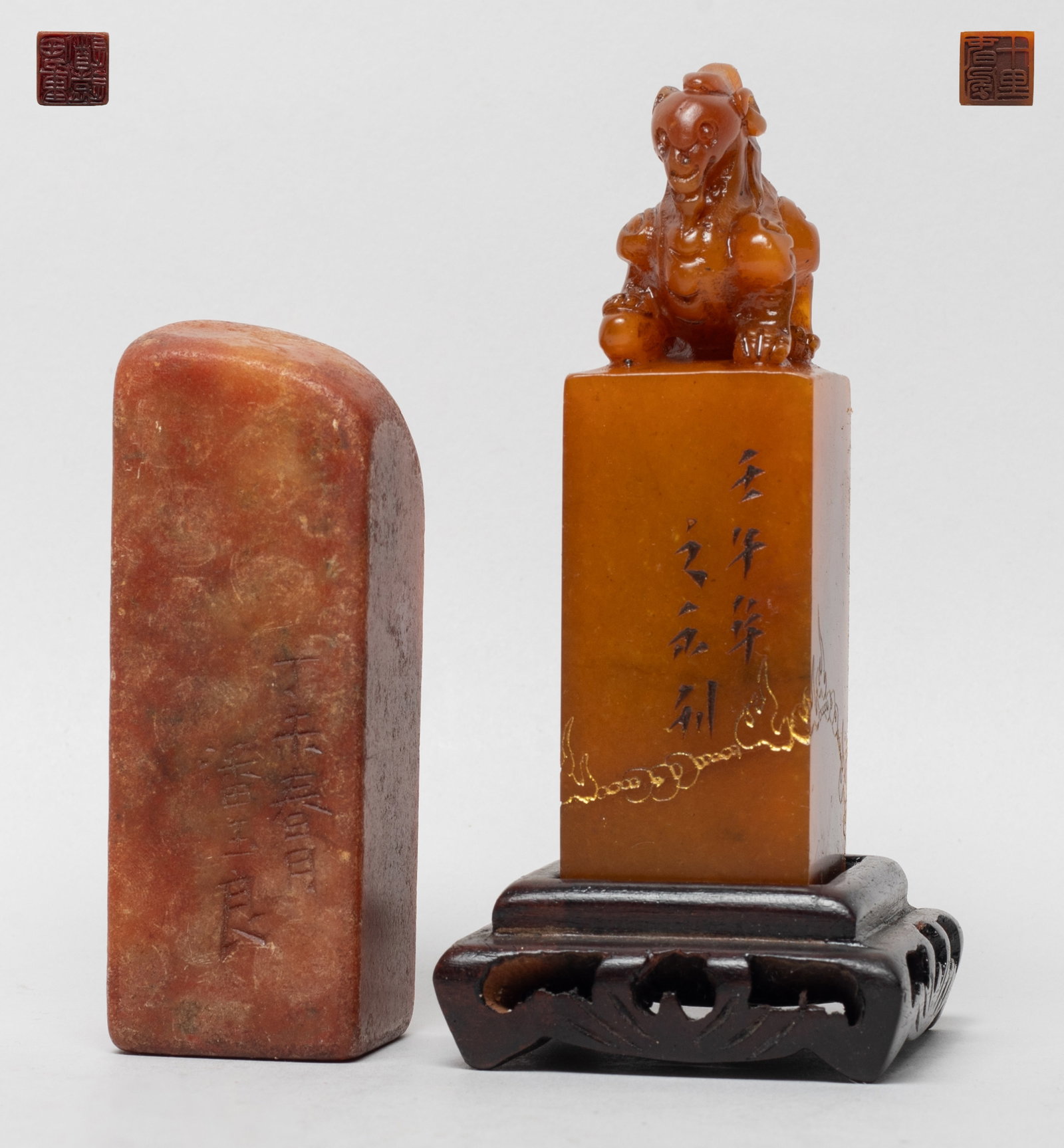 Two Chinese Shoushan Stone Seals: Two brown Shoushan stone seals of square section, wherein one carved with a crouching beast on the top, with a stand. Approx. 3.9*1.2*1.2 inch (larger seal).