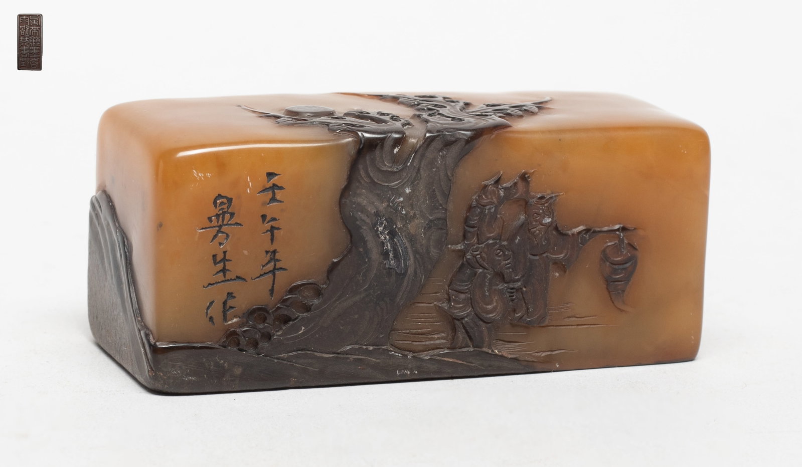 Rare Chinese Shoushan Stone Russet Skin Seal: Of rectangular section, the exterior carved with three figures under a tree, the front figure holding a lantern, the reverse with rolling hills and pavilions. Approx. 3.1*1.3*1.3 inch.