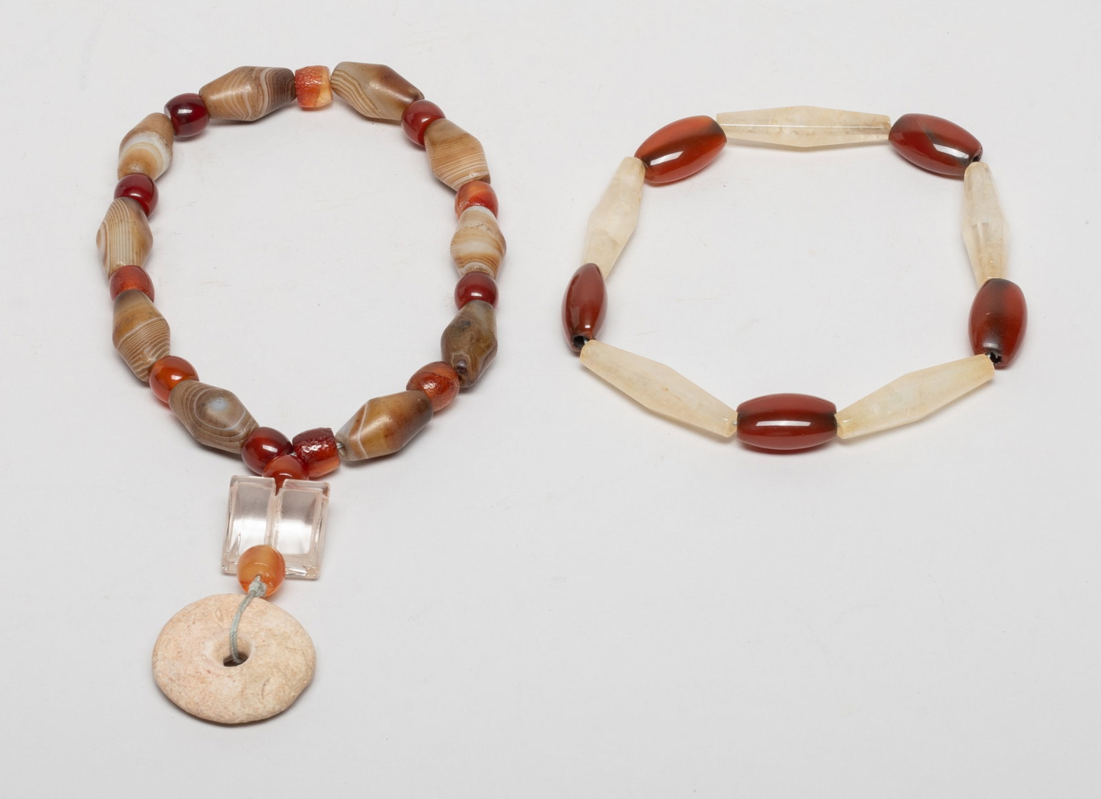 Chinese Cameo Agate, Crystal Beads: Including a string of long agate and crystal beads, and a string of agate beads suspended with a crystal pendant and a stone pendant. Size varies. The Estate of Downtown, Los Angeles. 2022.
