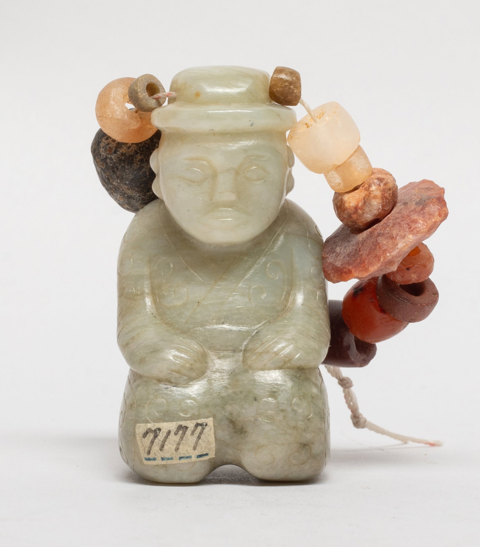 Chinese Jade Pendant w/ Agate Beads: Chinese jade pendant carved of kneeling figure form, dressed in a robe incised with scrolls, suspended on a string of agate beads. Approx. 2.3*1.2*1.15 inch (jade size). The Estate of the Joseph & Fam