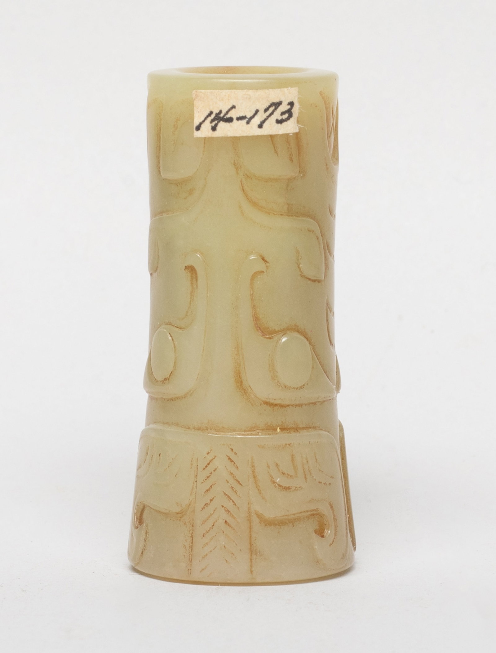 Chinese Russet Jade Bead: The large jade bead exterior carved with two archaistic masks. Approx. 2.14*1 inch. The Estate of the Consignment Store Closed Sale. Palm Springs. CA. 2025.
