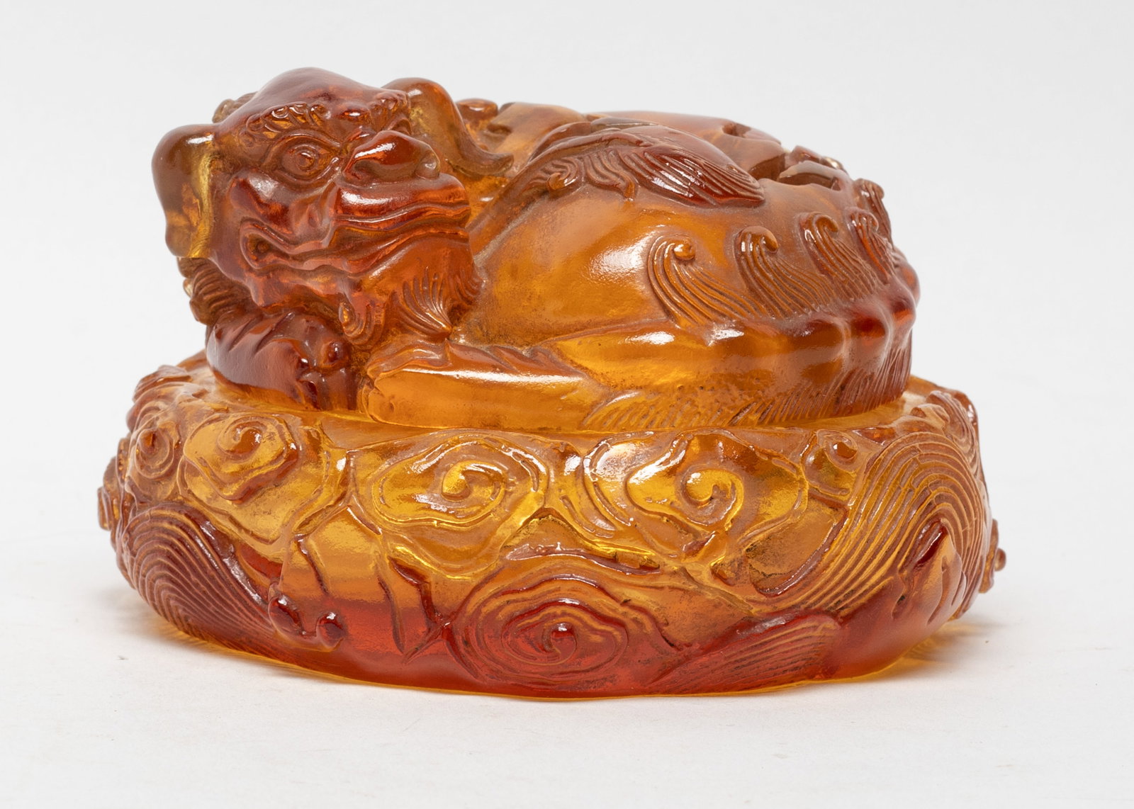 Estate Chinese Amber Like Glass Censer: The lid carved as as a coiled beast, the censer exterior carved with clouds and waves. Approx. 4.5*2.9 inch.