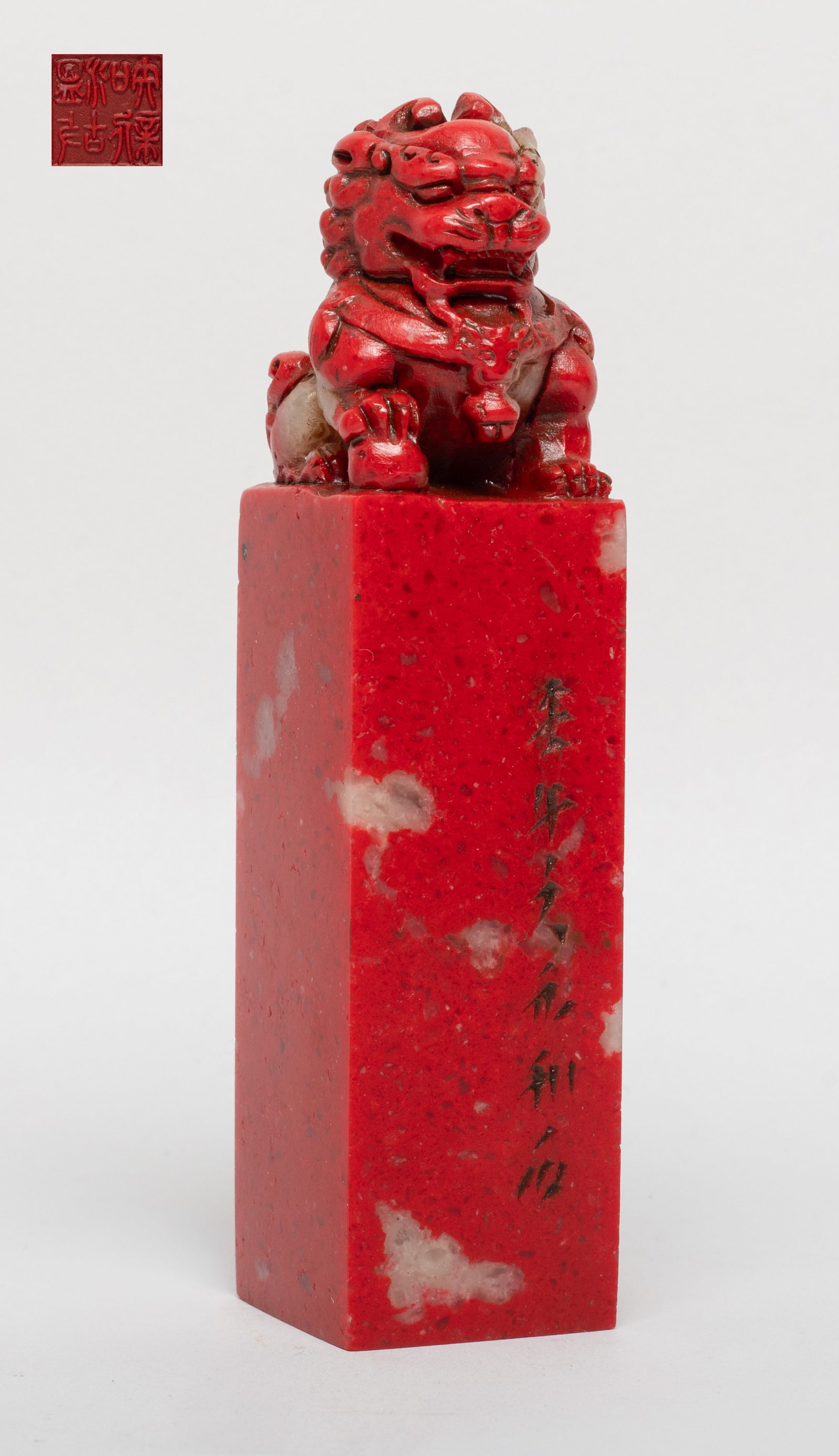 Estate Chinese Stone Tall Seal: Of tall square section, carved on the top with a crouching beast, carrying a ball in right front paw. Approx. 5*1.2*1.2 inch.