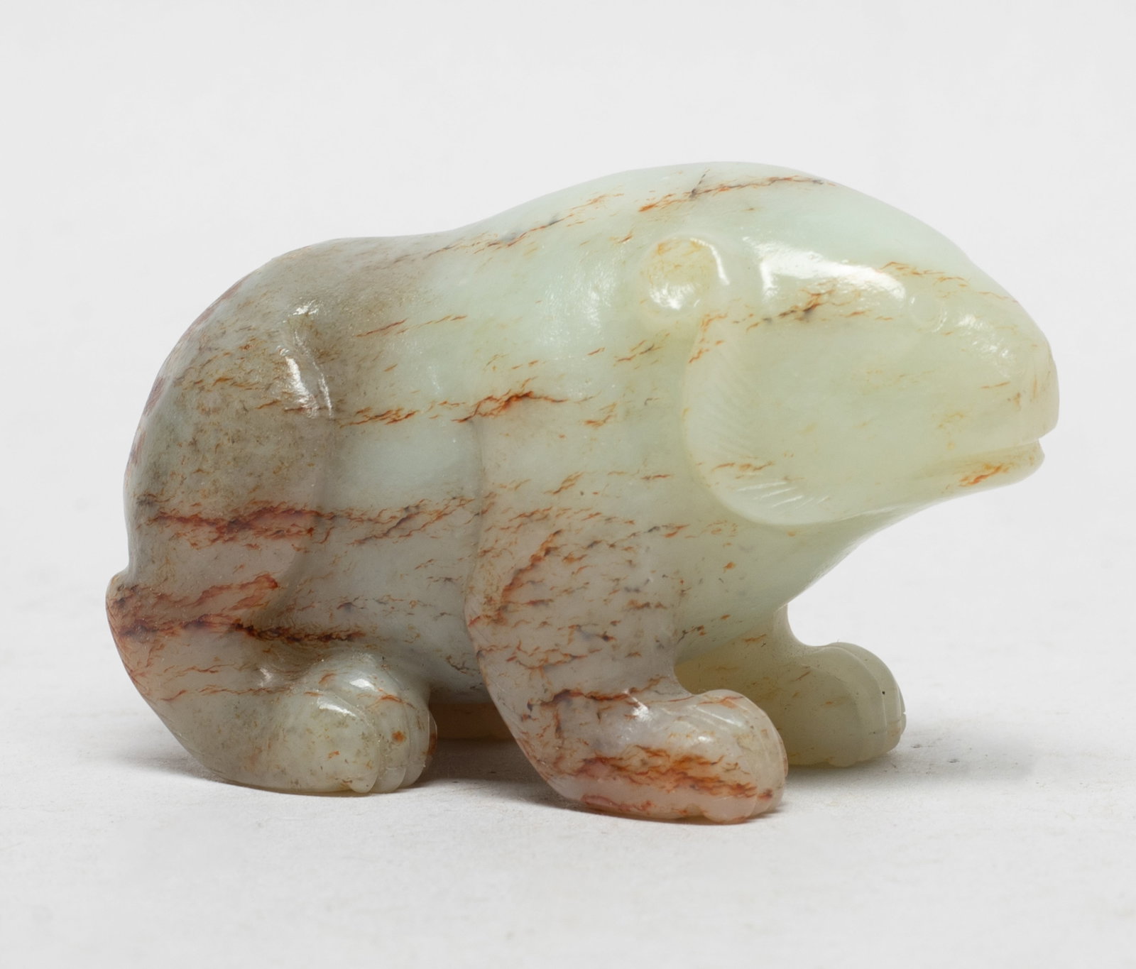 Chinese Russet Jade Sculpture: Chinese russet jade pebble carved of recumbent beast form. Approx. 2.85*1.75*1.4 inch.