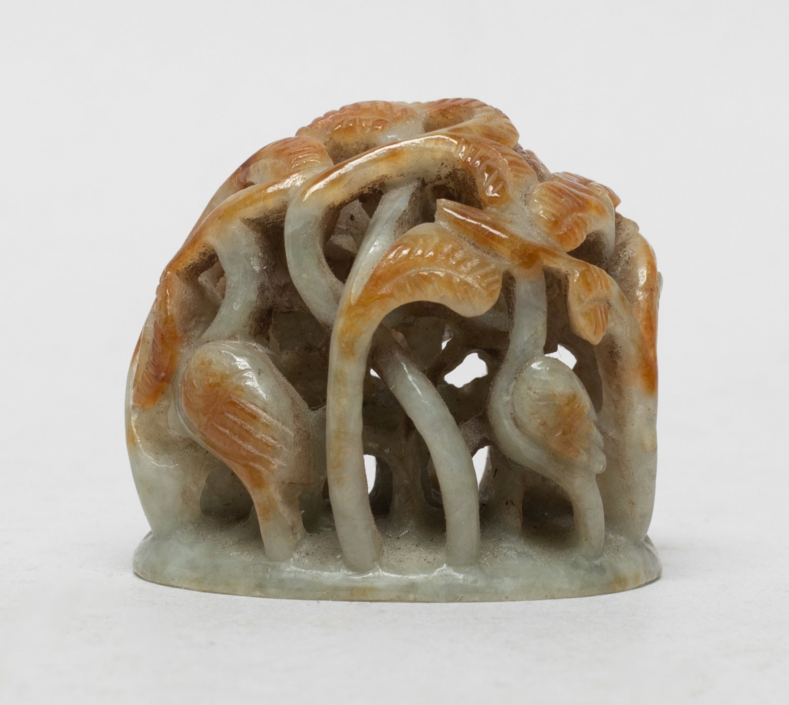 Chinese Russet Jade / Stone Hat Finial: Chinese russet jade / stone hat finial carved and reticulated with egrets amongst leafy stems. Approx. 1.77*1.58*1.5 inch.