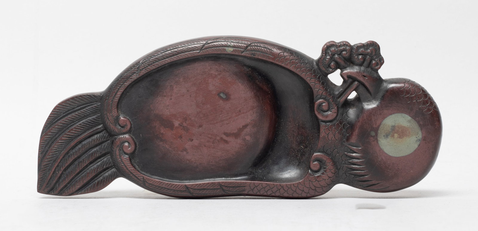 Estate Chinese Duan Type Ink Stone: Worked of bird form, grasping lingzhi in the beak, the underside with inscription. Approx. 7.5*3.05*0.9 inch.