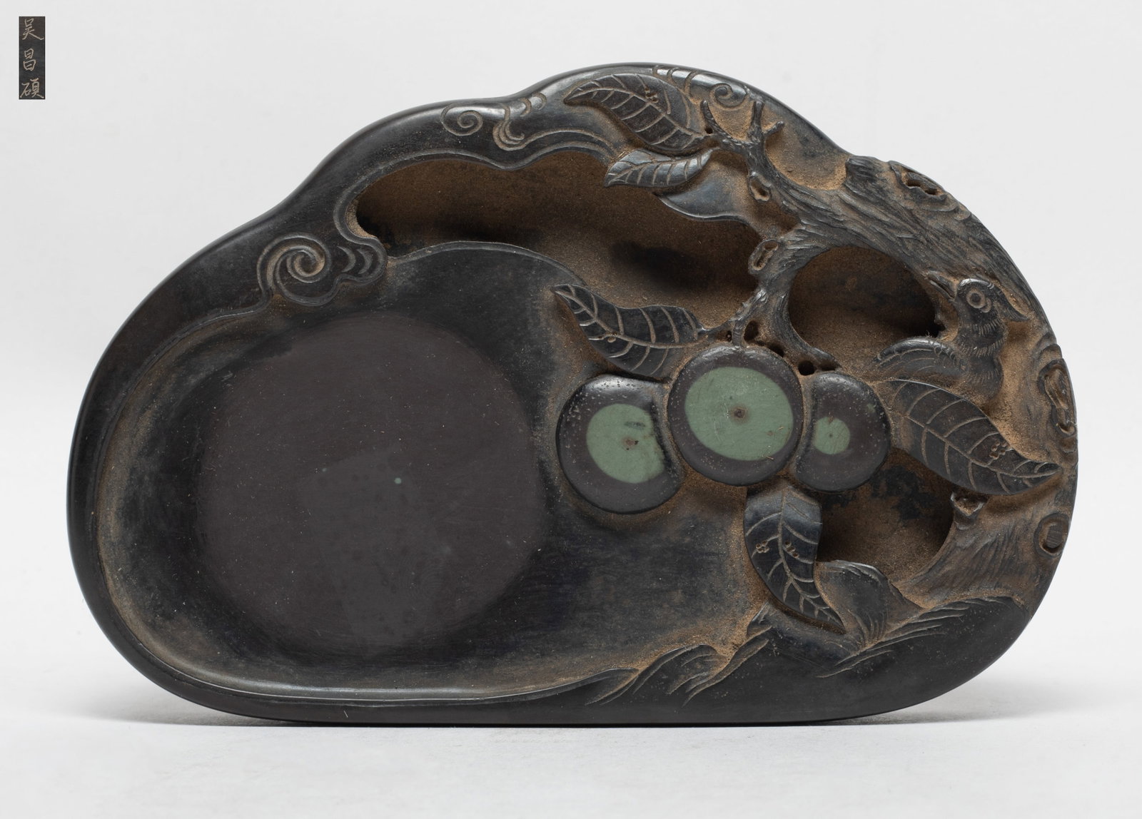 Estate Chinese Duan Stone Ink Piece: Carved in openwork with fruit tree branches, a bird covered by leaf looking backward, the underside incised with three characters. Approx. 6.5*4.3*0.97 inch.