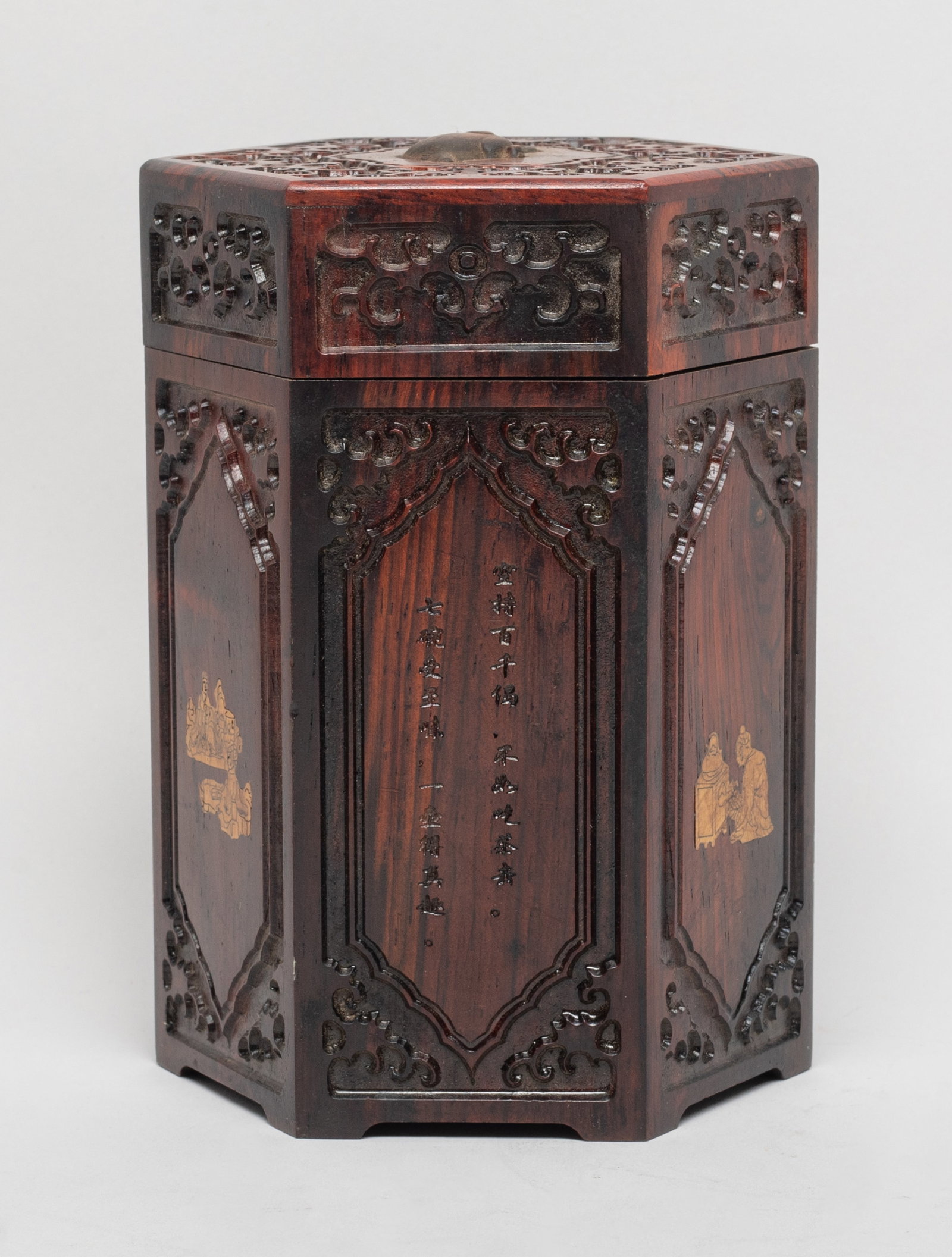 Vtg. Chinese Wood Brush Pot: Of hexagonal section, the sides carved with figural scene and inscribed with related poems, the top centre carved with a raised tea pot among scrolls. Approx. 5.6*4*3.5 inch. The Estate of E Los