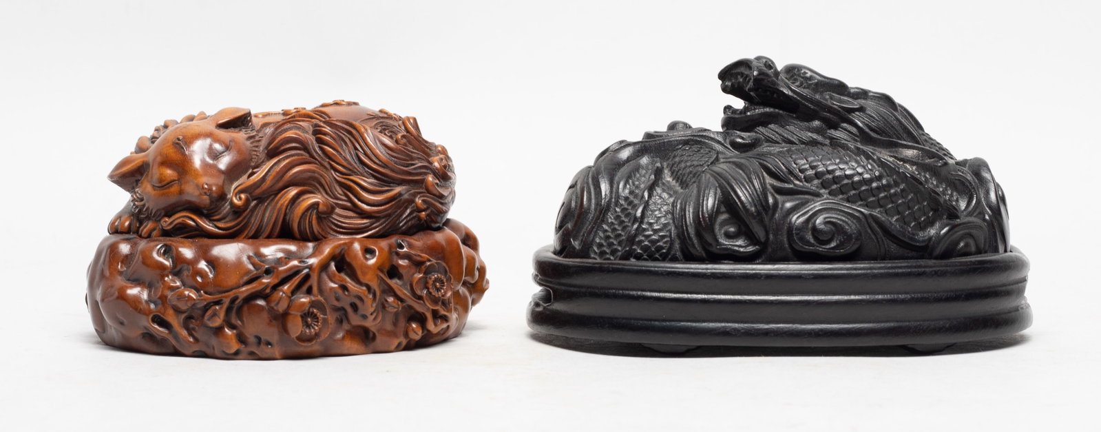Two Special Form Chinese Wood Incense Burner: One burner carved with a coiled dragon carrying a ball in paw, the other burner carved with a recumbent fox and plum blossoms. Approx. 5.5*3.8*3.1 inch.