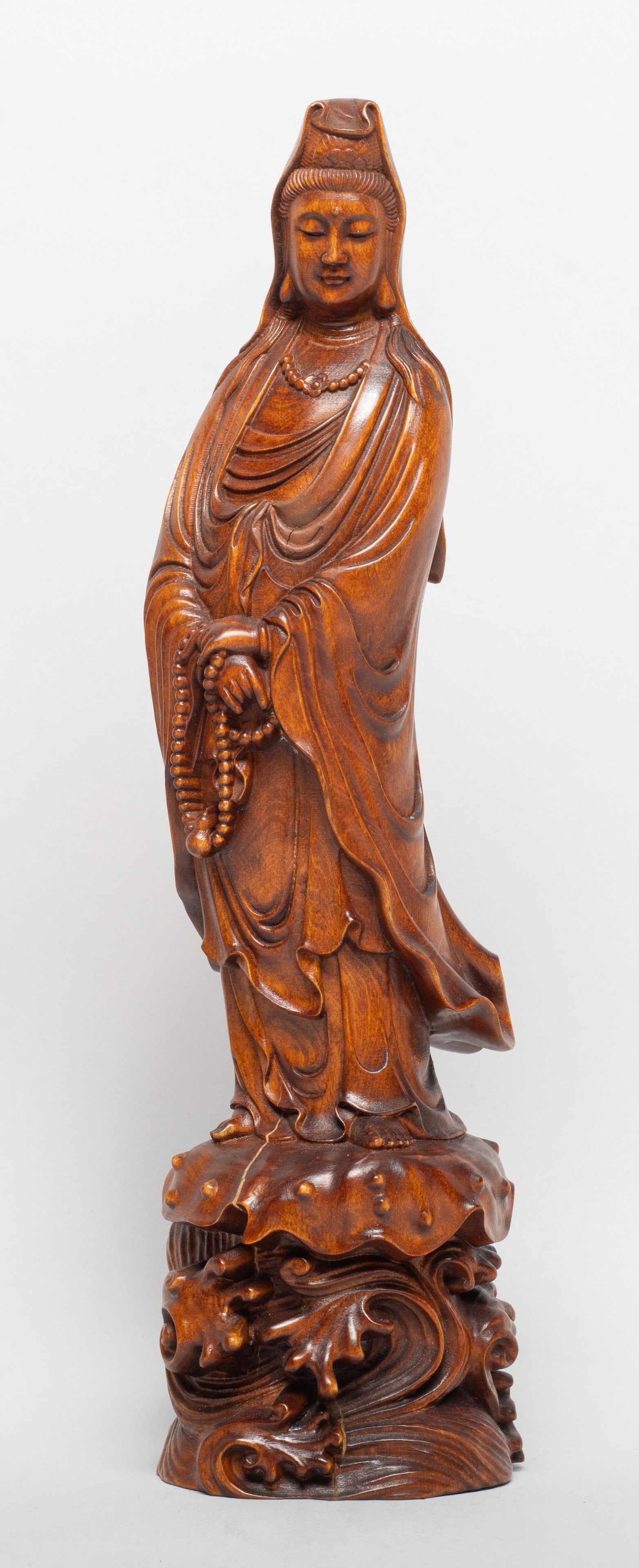 Estate Chinese Wood Carved Sculpture of Kuanyin: Carved as Kuanyin standing on foaming waves, wearing a long flowing robe and a mantle partially covers her hair, the hands holding prayer beads. Approx. 8.2*2.2*2 inch. The Estate of the Store Closed 