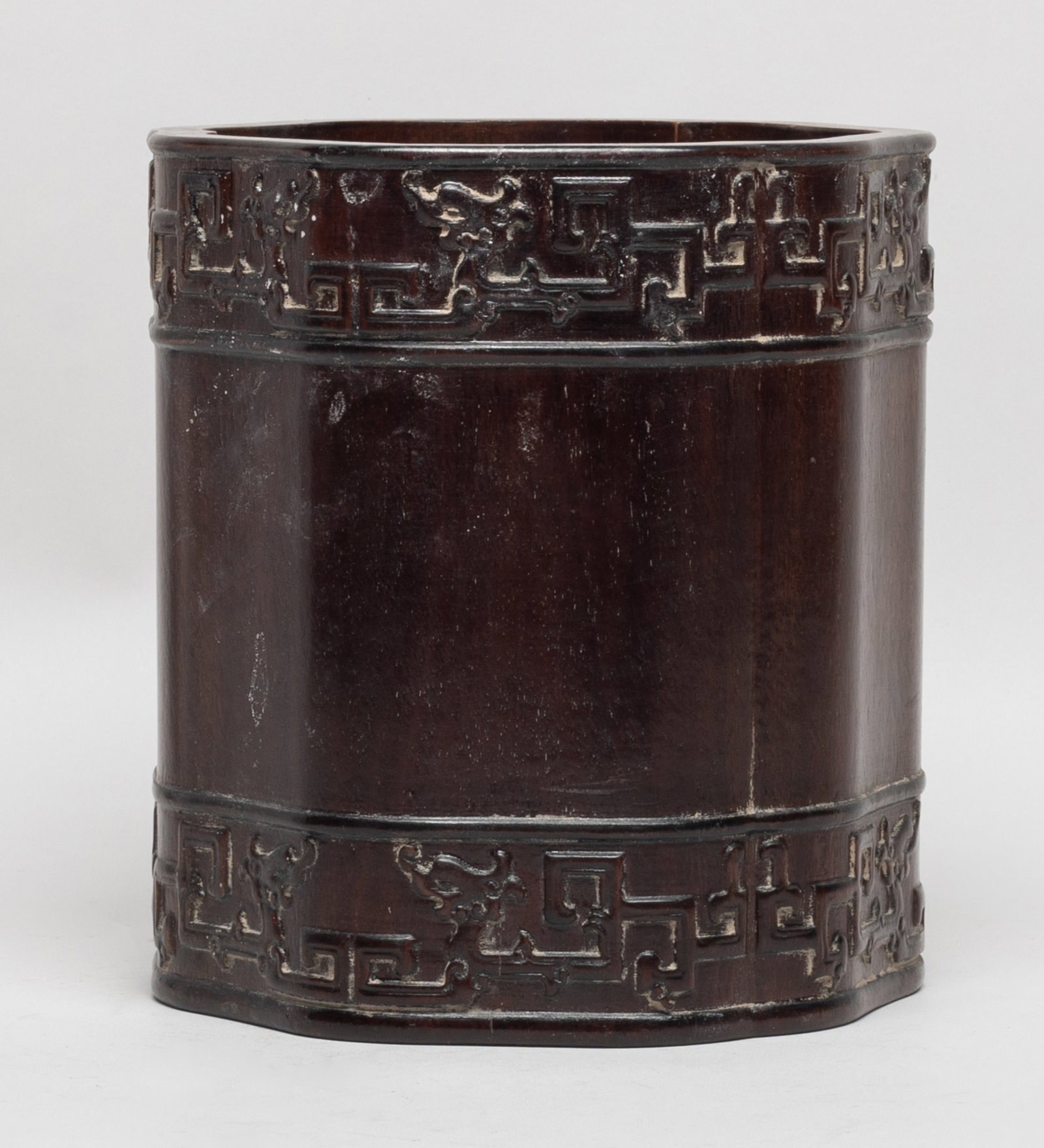 Vtg. Chinese Bark of Agarwood Brush Pot: The cylindrical body of floral form, carved around the mouth and foot with bands of archaic beasts. Approx. 6.6*6.1 inch. The Estate of the Judy & Mark. Los Angeles. 2020.